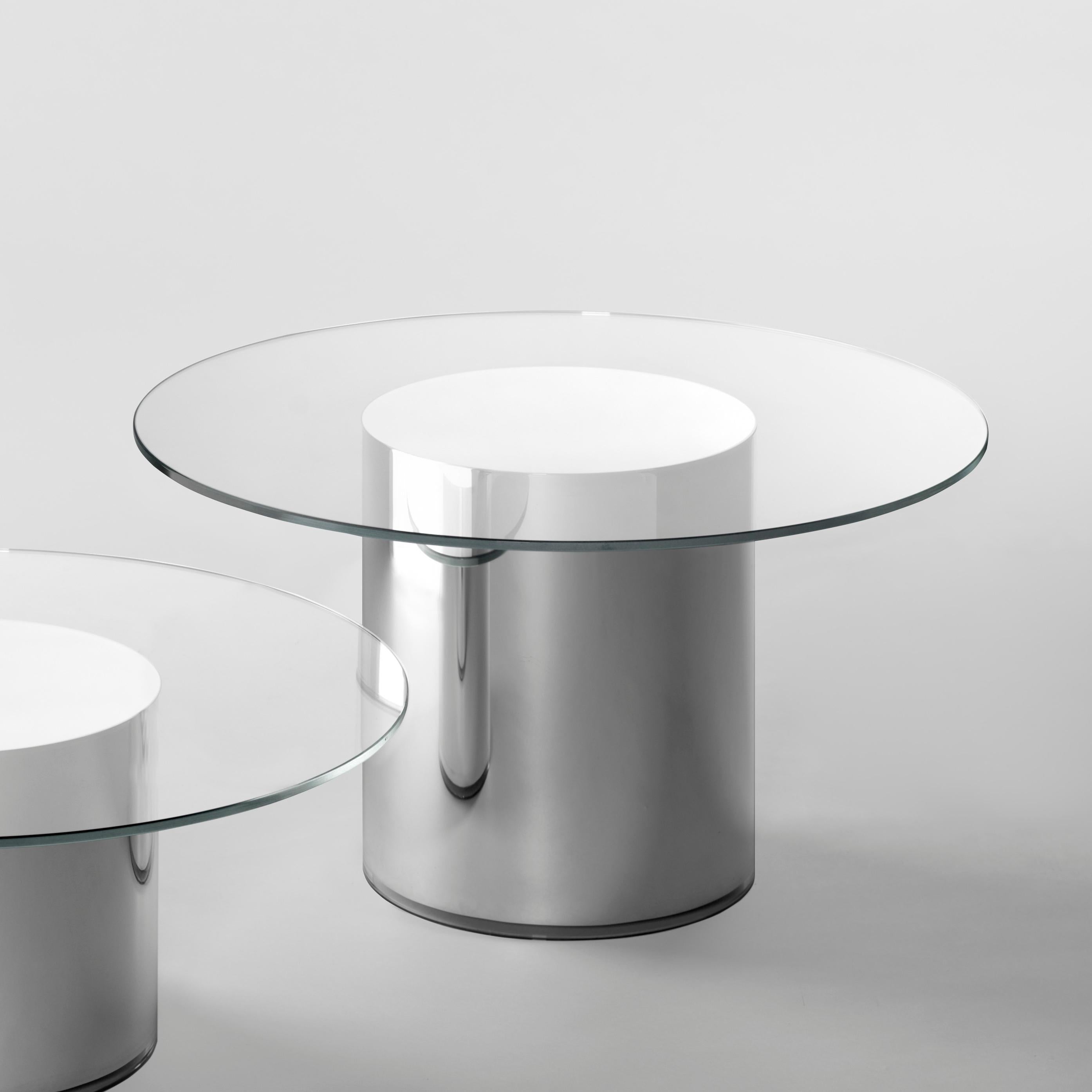 The 2001 Side Tables are made from an ultra-clear glass and a pyrex tube mirrored base, having no joinings. The metallic brilliance creates an optical illusion, evoking a perfect future not belonging to the past.

Ultra-clear tempered glass top and