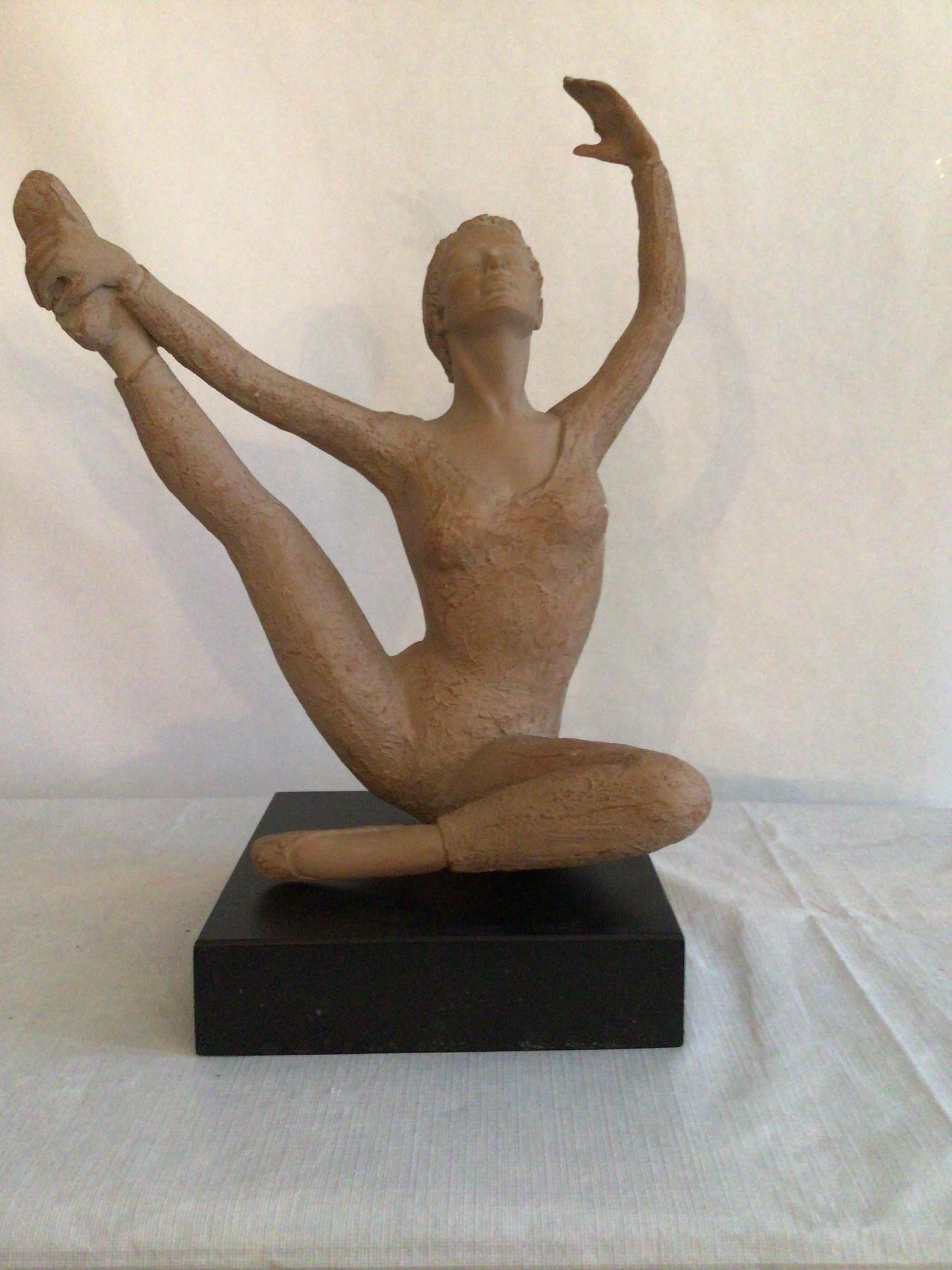 2001 Terracotta Sculpture On Wood Base Of A Ballerina Dancer Stamped AMR 
Black Painted Wood Base
Figure wears a textured leotard 
Seated with leg extended stretching
Yoga or Ballet pose
Holes Where Mounted (as shown)

