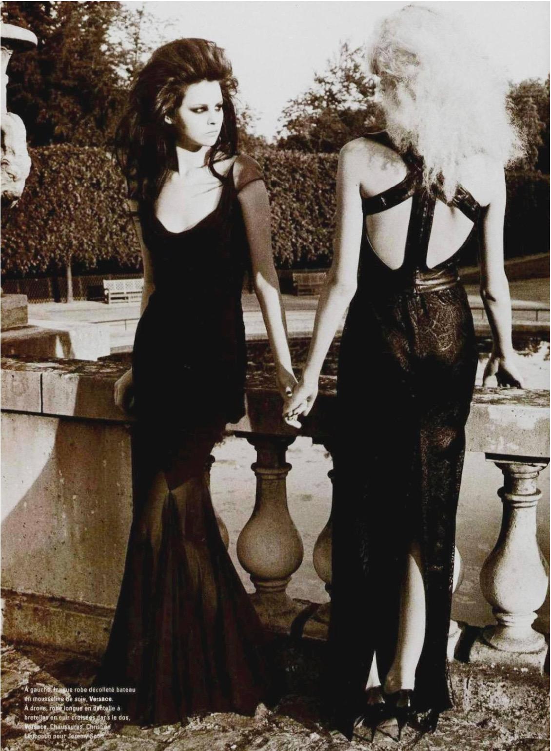 A highly coveted and ultra seductive Gianni Versace semi-sheer black silk chiffon bias-cut floor length gown dating back to Donatella Versace's iconic 2001 fall-winter collection. This exceptional dress is documented runway look #59. The garment