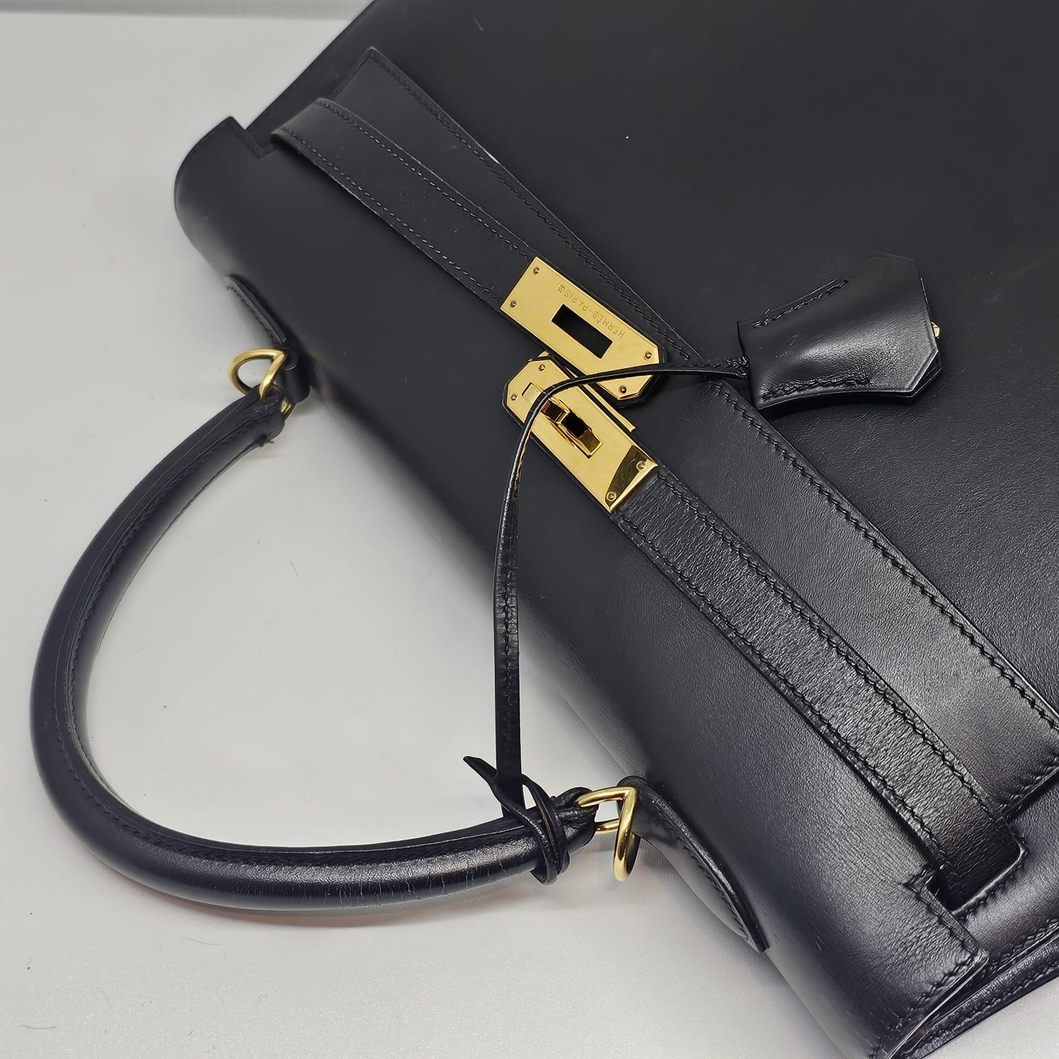 Item is in fair condition with missing strap. Some touch ups have been done, especially on the handles and corners. There is a minor tear on one of the corner. Visible rubbing on the corners and scratches on the leather surface too. Handles shows