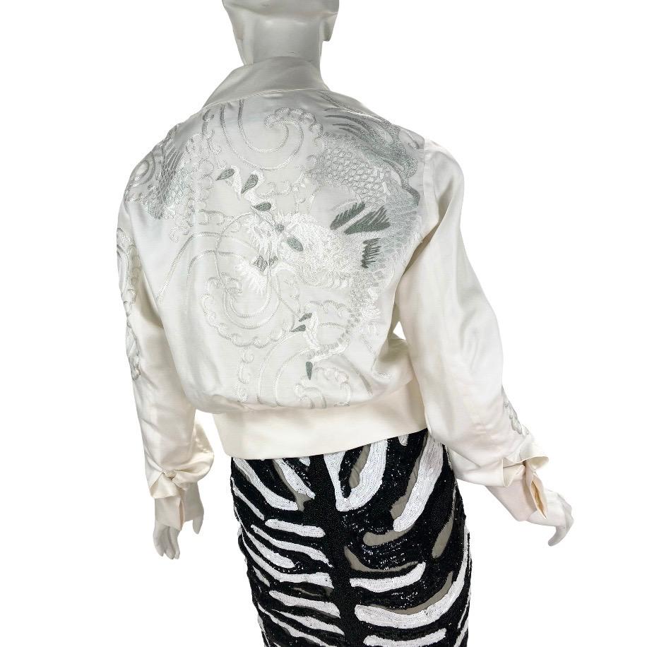 2001 
Vintage Tom Ford for Gucci 
White Silk Bomber Jacket with Dragon Embroidery 

IT Size 38 - US 4

100% Silk

Fully lined

Made in Italy

Excellent condition

Shown with Tom Ford embellished skirt
Also available in our store
