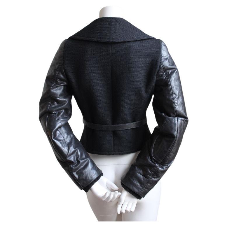 Very rare black wool jacket with leather sleeves and belt from Balenciaga dating to fall of 2002 exactly as seen on the runway. French size 38, although this best fits a French size 36 or US 2.  Approximate measurements: shoulders 14