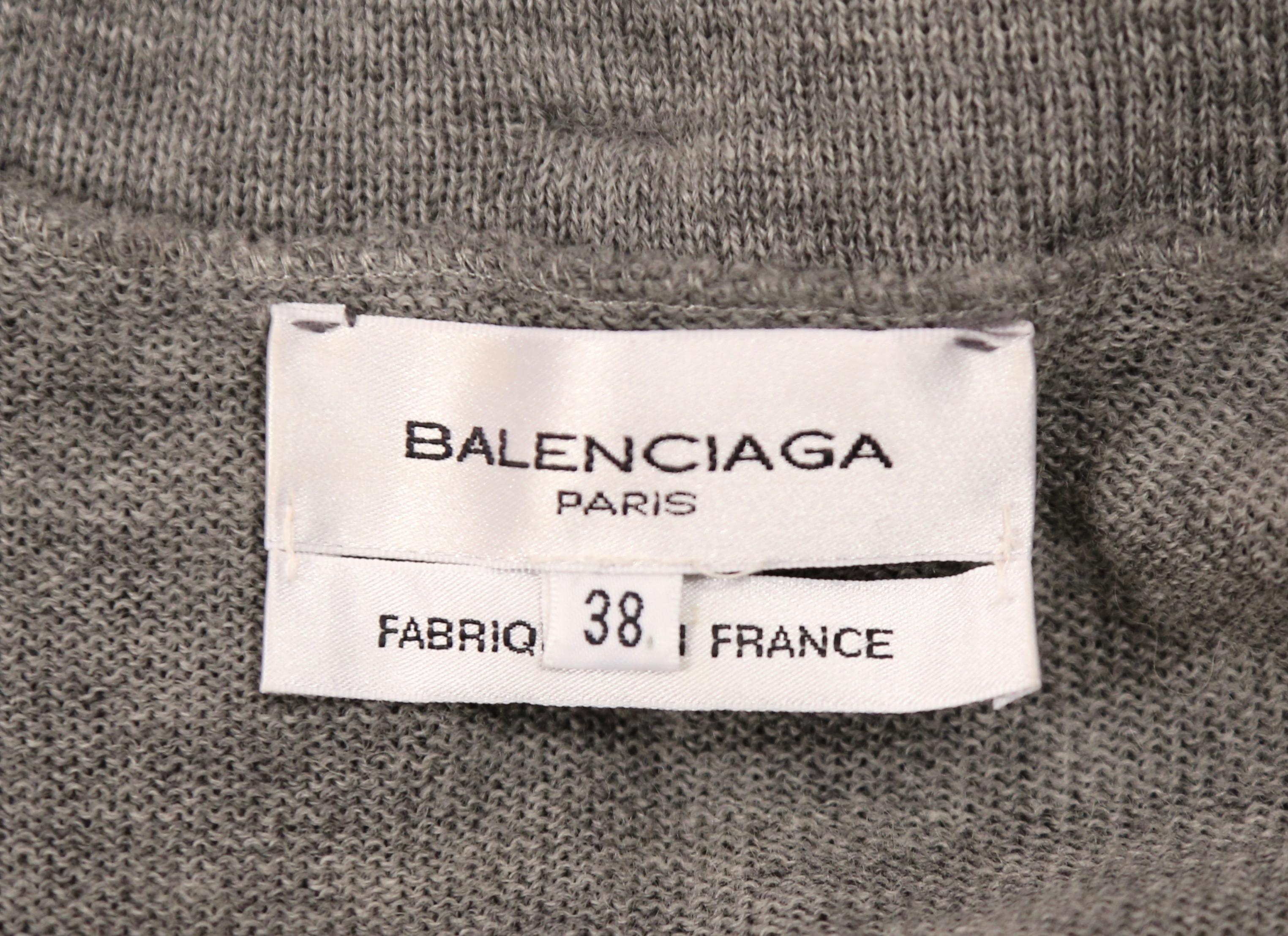 Very rare, grey wool patchwork dress with denim and leather trim designed by Nicolas Ghesquière for Balenciaga exactly as seen on the fall 2002 runway. Labeled a French 38 however this would best fit a French 36. Approximate measurements: bust 32