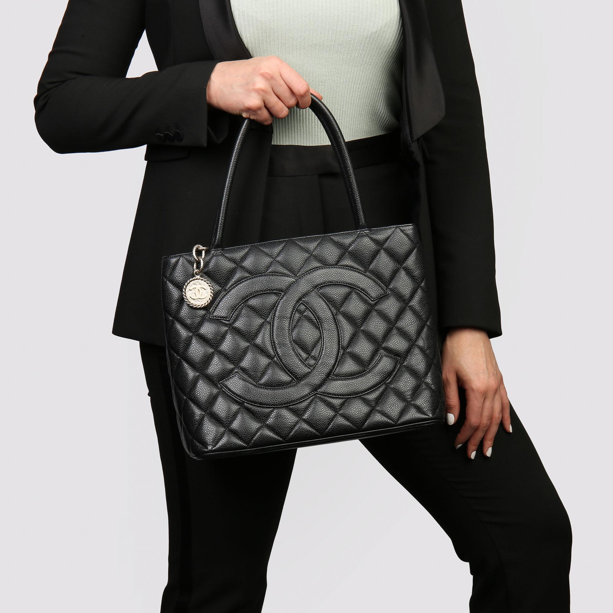 CHANEL
Black Quilted Caviar Leather Vintage Medallion Tote 

Xupes Reference: HB3753
Serial Number: 6795470
Age (Circa): 2002
Accompanied By: Authenticity Card, Care Booklet 
Authenticity Details: Authenticity Card, Serial Sticker (Made in France)