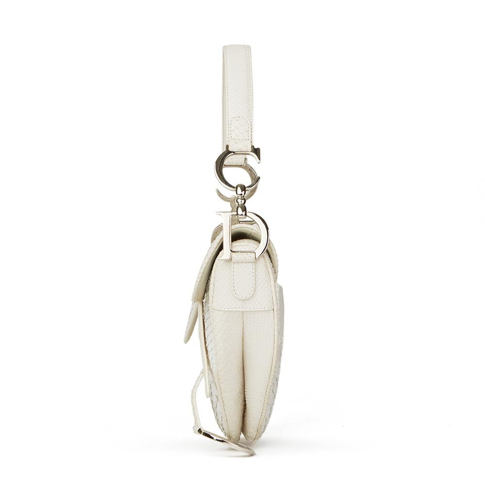CHRISTIAN DIOR
White Python Leather Saddle Bag

Reference: HB2389
Serial Number: 10-MA-1022
Age (Circa): 2002
Authenticity Details: Date Stamp (Made in Italy)
Gender: Ladies
Type: Shoulder, Top Handle

Colour: White
Hardware: Silver
Material(s):