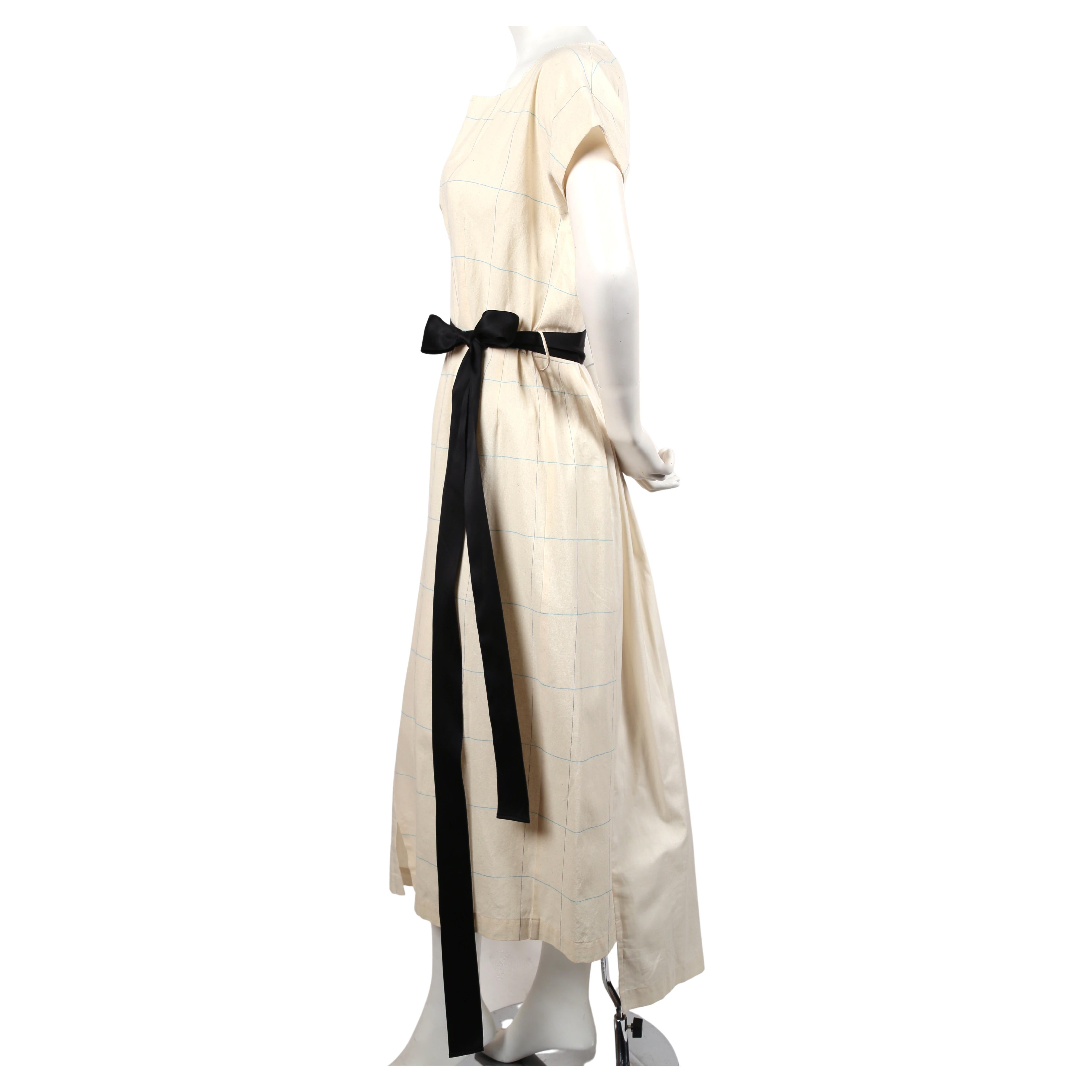 Cream and plaid asymmetrically paneled runway dress with long black tie designed by Rei Kawakubo for Comme Des Garcons exactly as seen on the spring 2002 runway. Raw neckline. Japan size M. Approximate measurements: 34