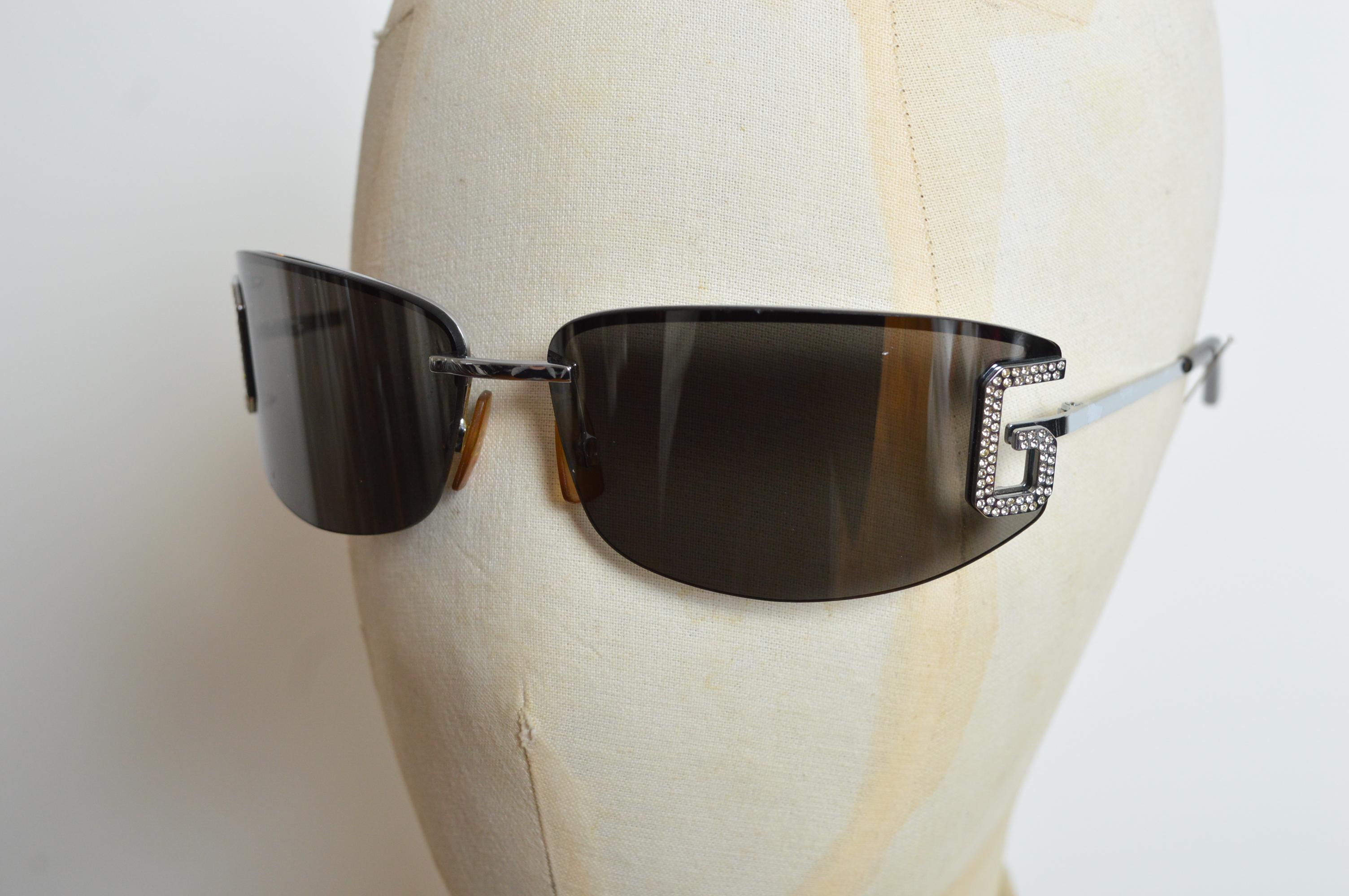 Iconic 2002 Dolce & Gabbana Swarvoski encrusted lense Shades.
Chrome hardware with Grey tinted lenses. 
MADE IN ITALY. 
Size - One size / Standard
Measurements in inches:
Frame length across the Front - 5.5”
Frame hight - 1.75”
Condition; 8/10