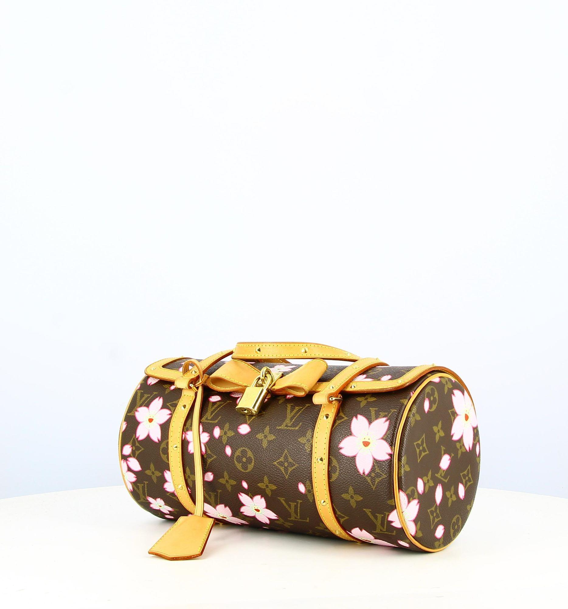 2002 Louis Vuitton X Takashi Morikami Monogram Butterfly Bag with Flowers
- Good condition, has slight traces of wear and tear with time.
- Butterfly handbag, monogram, flower motifs by Morikami, leather shoulder straps, leather bow tie in the