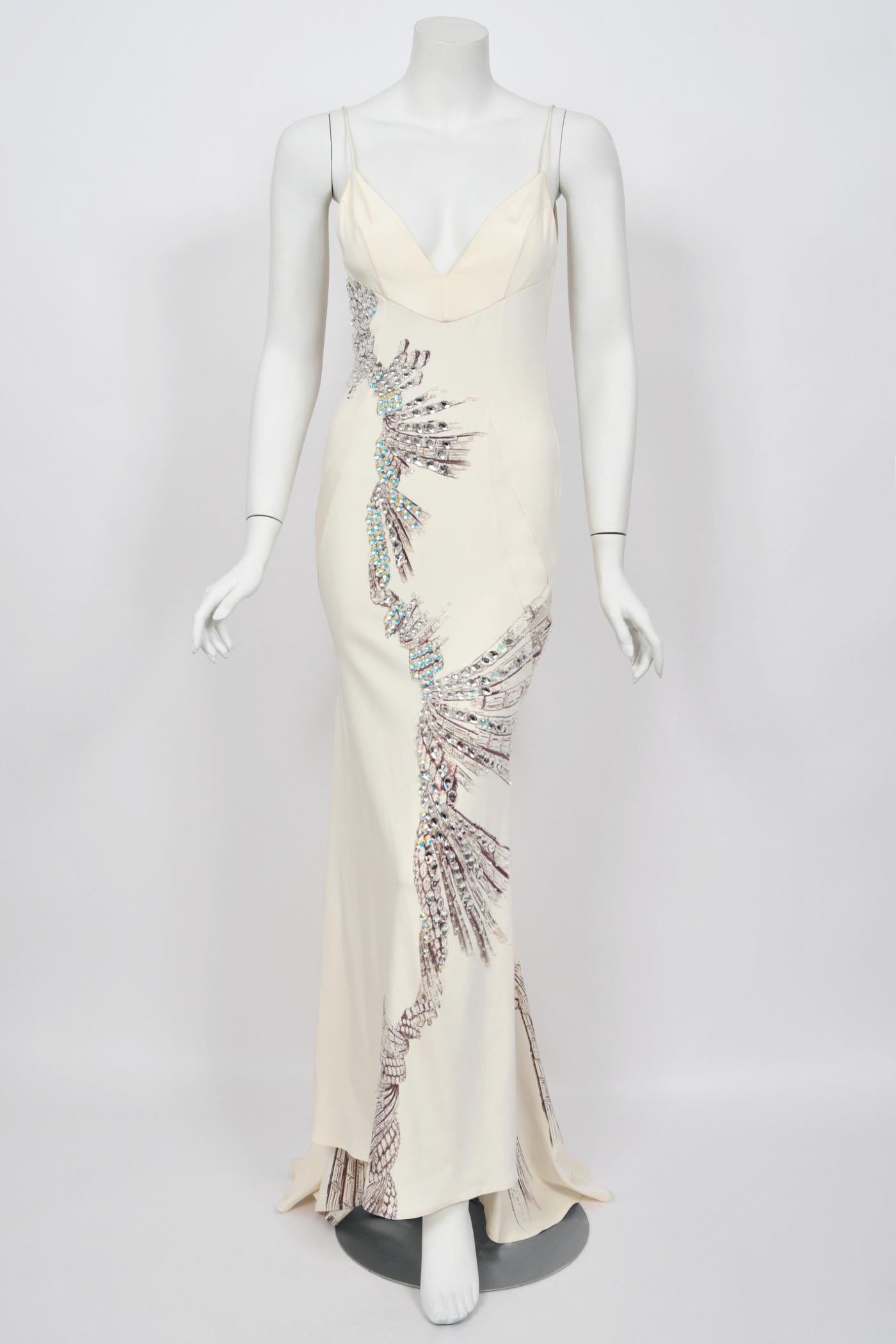 An incredibly special and highly coveted Roberto Cavalli ivory crystal embellished  stretch silk gown dating back to his 2002 fall-winter collection. This unforgettable dress was documented runway look #63 worn by Cindy Crawford. Roberto Cavalli