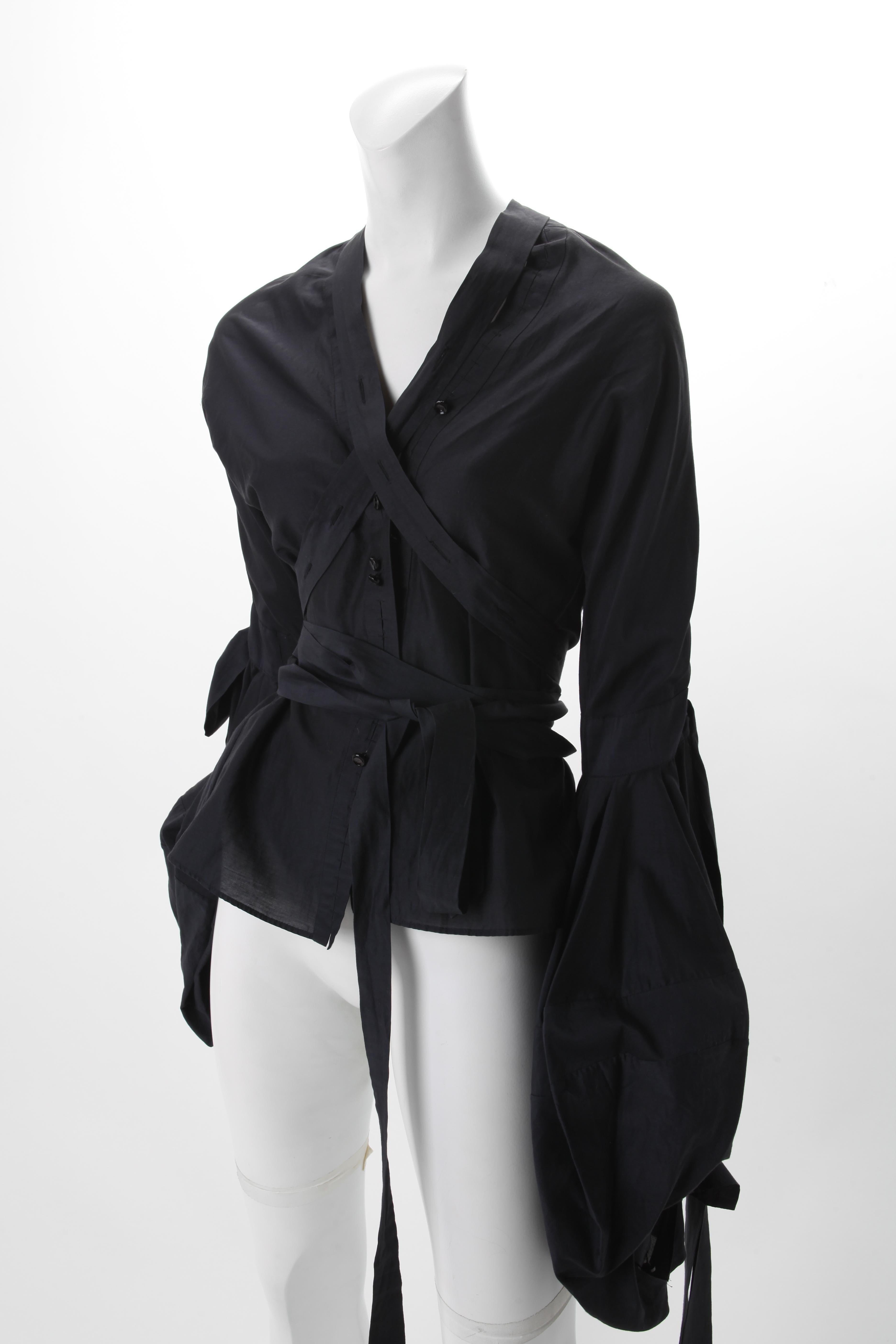 2002 Tom Ford for Yves Saint Laurent Black Cotton Peasant Blouse F38
Lightweight black Cotton and Silk Blouse with Elongated Ties; Bishop Sleeves.