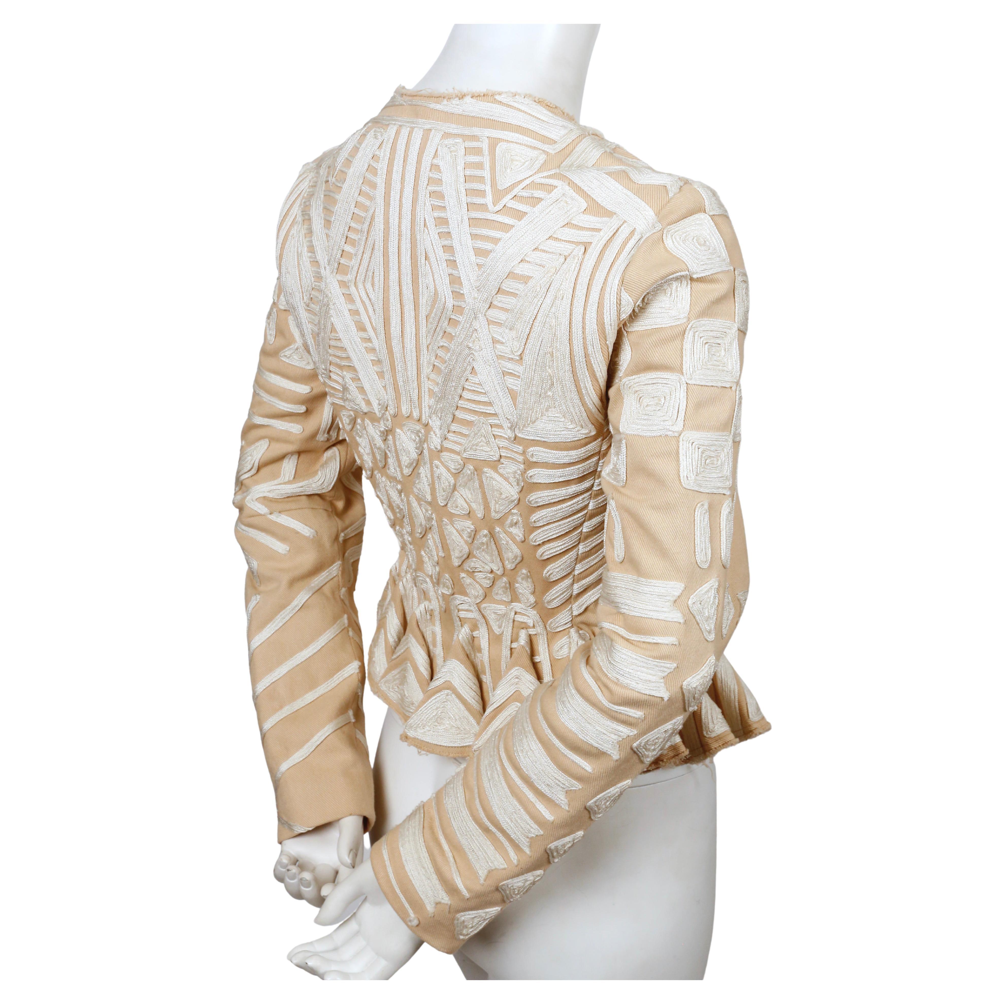 Very rare, tan canvas peplum jacket with embroidery designed by Tom Ford for Yves Saint Laurent exactly as seen on the runway for Spring 2002. Labeled a French size 38 although this also fits a French 36 or US 2-4.  Approximate measurements: 14.5