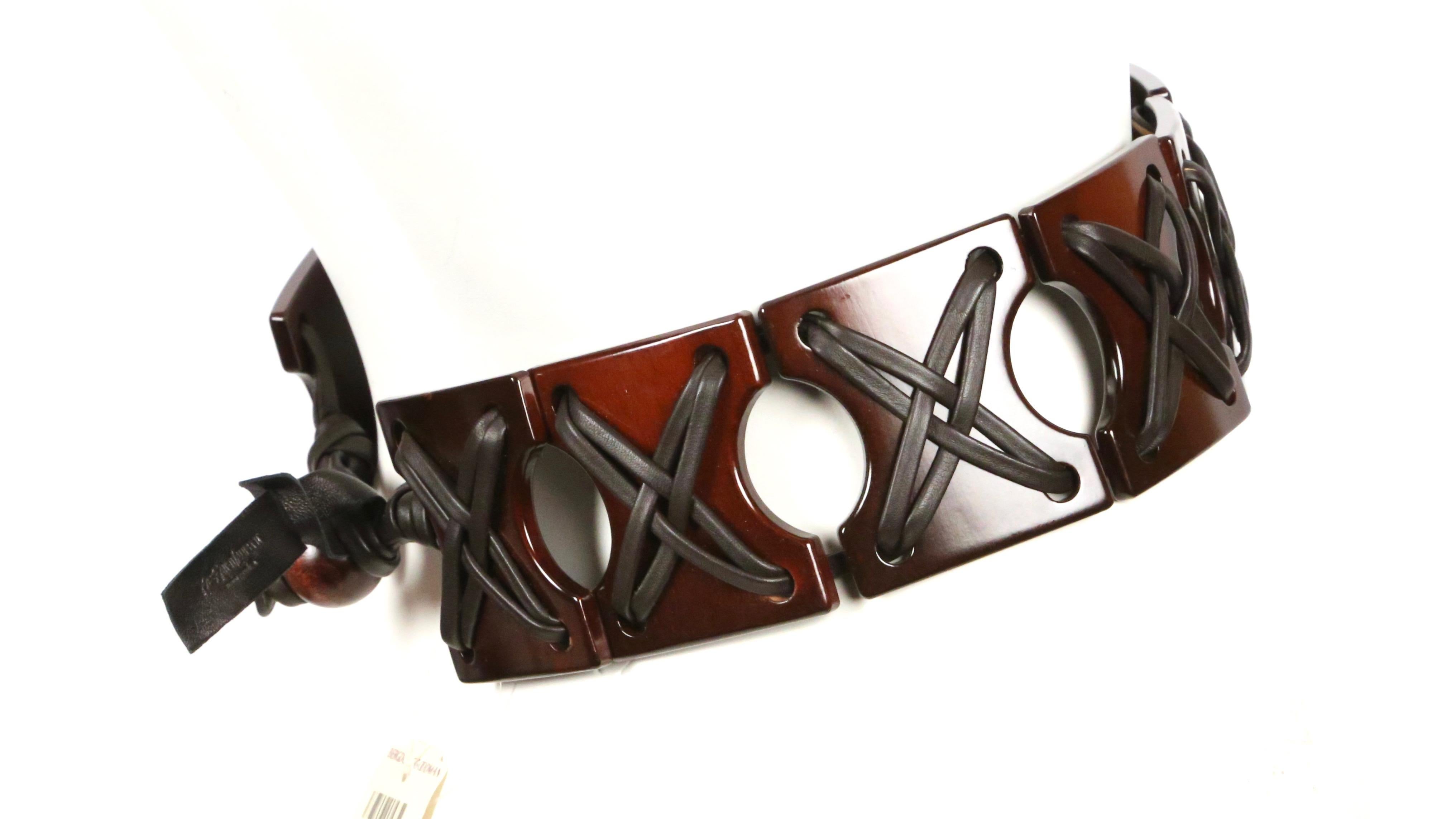 Brown wood and leather belt designed by Tom Ford for Yves Saint Laurent rive gauche dating to spring of 2002. Labeled a size 'S'. Approximate measurements: length 27