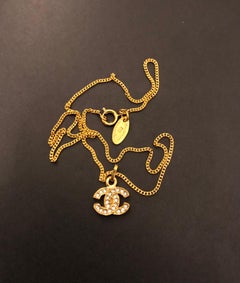 1980s Vintage CHANEL Gold Toned Rhinestone CC Charm Chain Necklace