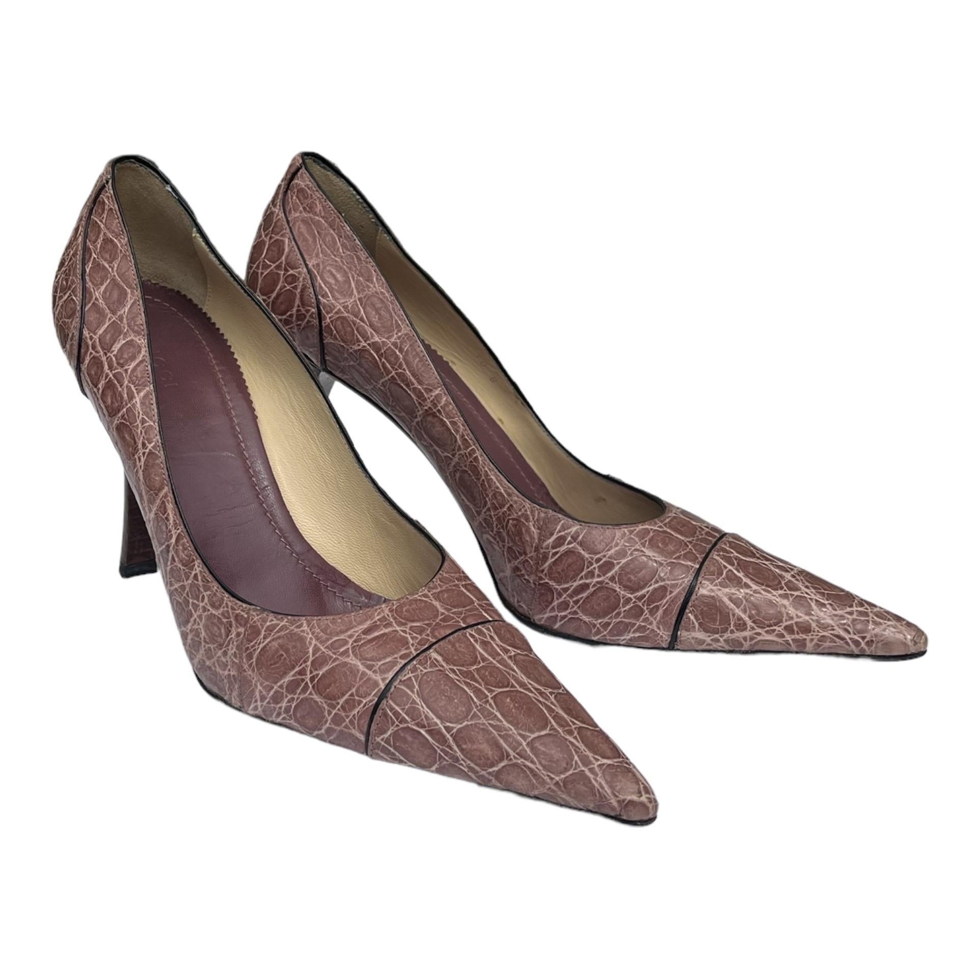 GUCCI CROCODILE SHOES FROM TOM FORD'S 2002 FALL COLLECTION
New Gucci's shoe reaches new heights of show-stopping style in genuine crocodile skin with pointy toe and high heel.
Italian size 40 B - US 10 B
Color: Dusty Rose
Genuine Crocodile, Leather