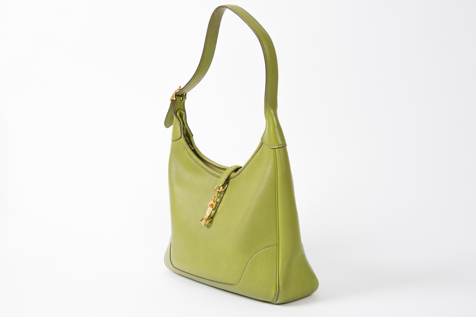 2002s Hermes green shoulder leather Trim tote bag featuring a shoulder handle, a top zip opening, an inside logo stamp, a silver tone hardware. Letter: F in a square
In good vintage condition. Made in France. 
We guarantee you will receive this
