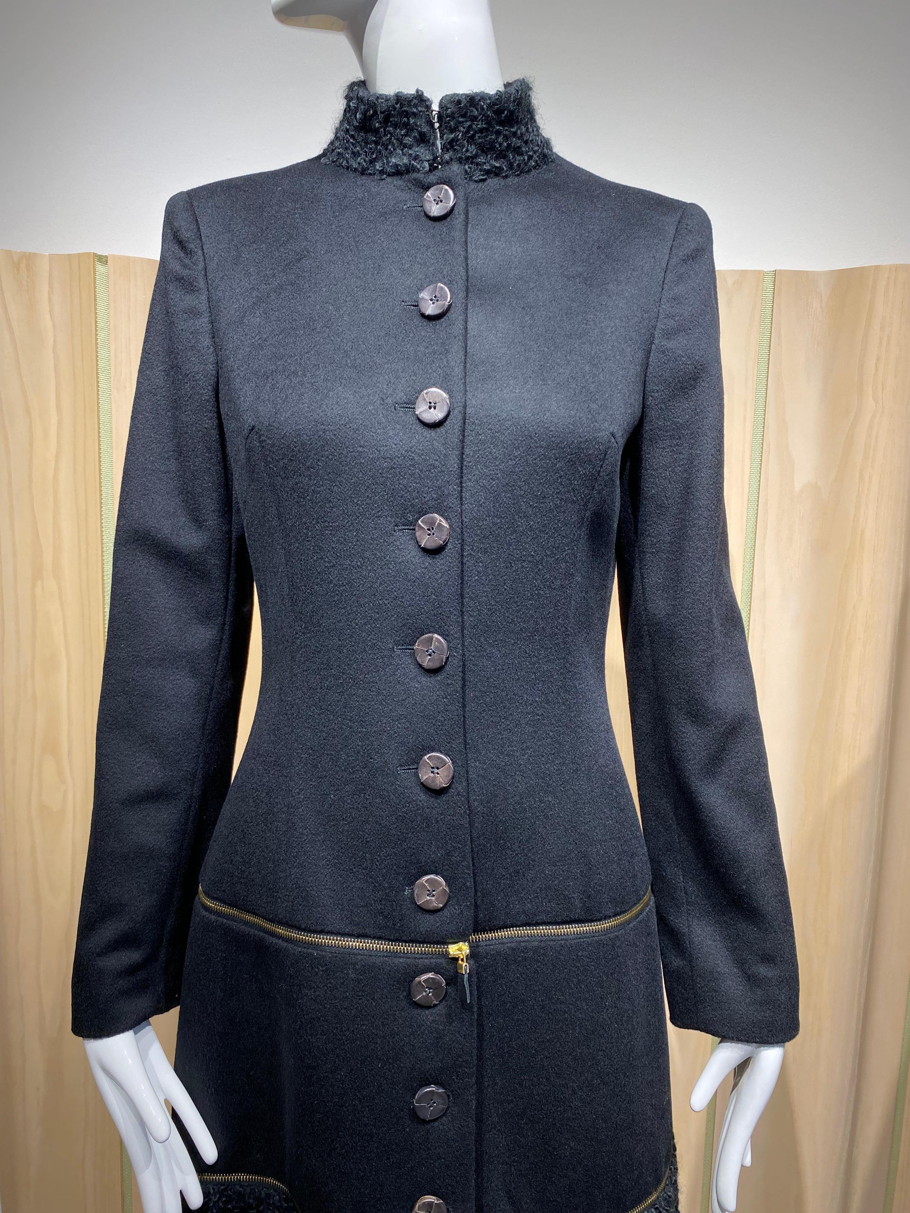 2002 Alexander Mcqueen Black cashmere wool fitted coat dress, jacket and coat dress ( 3 in 1) style.
Coat can be worn as jacket, or coat or dress.
leather buttons
zippers
silk lining
Marked size 38 IT fit size 2/4 US size
