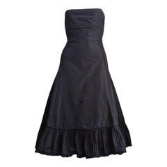 2003 ALEXANDER MCQUEEN black taffeta dress with pleated hemline trimmed in fur
