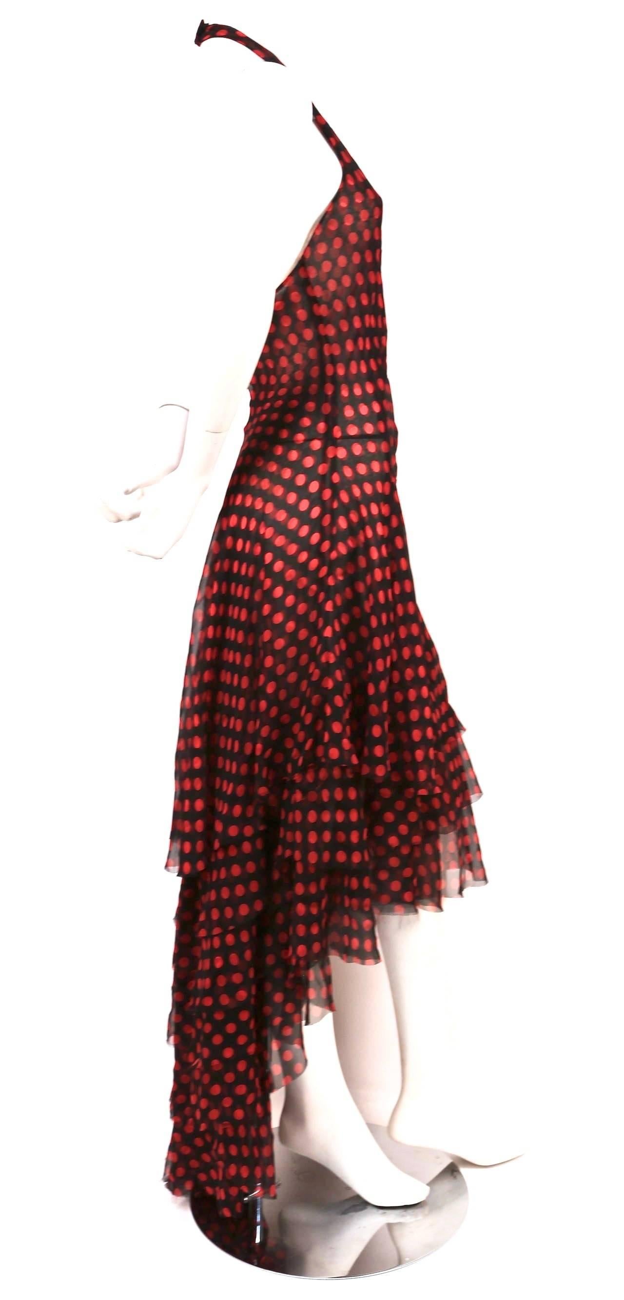 Very rare, black halter gown raw edged tiers, high-low hemline and red polka dots designed by Alexander McQueen dating to spring of 2003, exactly as seen on the runway. Dress best fits a us size 6-10. Measurements are difficult to take because this