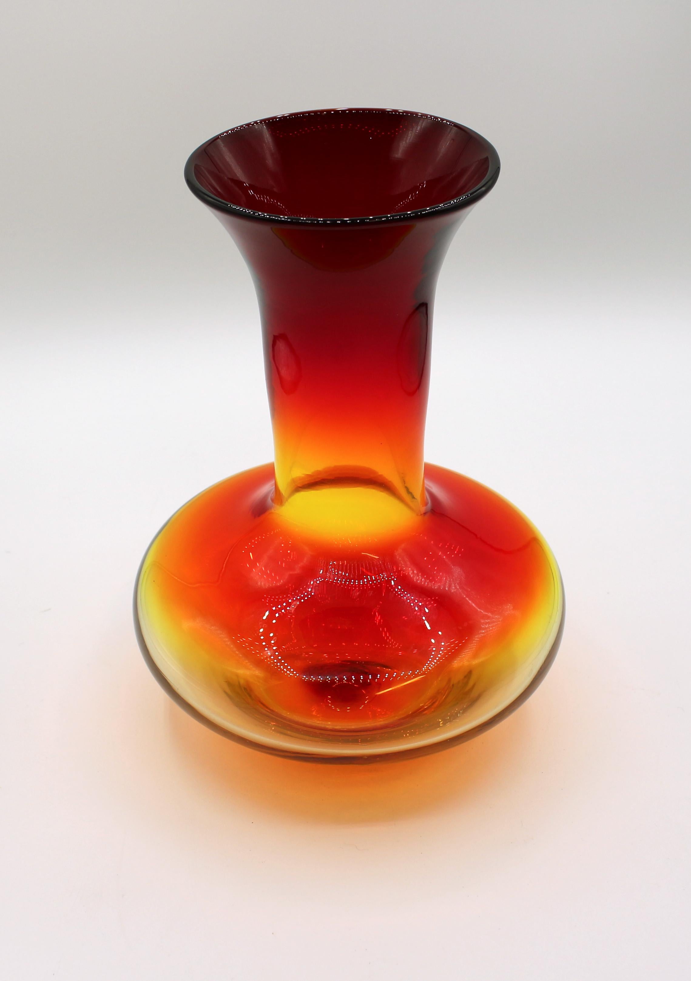 2003 Blenko artist signed hand blown glass carafe for wine or flowers. Amberina which glows orange to yellow/green. Measures: 9 3/4