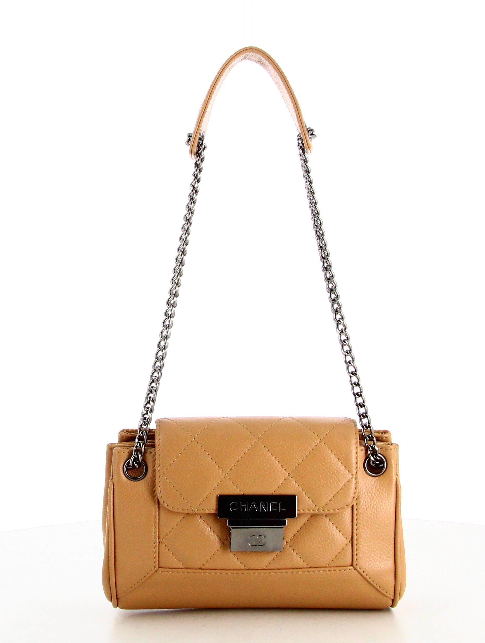 2003 Chanel Small Beige Quilted Handbag 

- Very good condition. Shows very slight signs of wear over time.
- Chanel Small Handbag 
- Beige leather chain 
- Clasp: silver Chanel logo on front 
- Inside: Chanel logo satin lining. Inside pocket