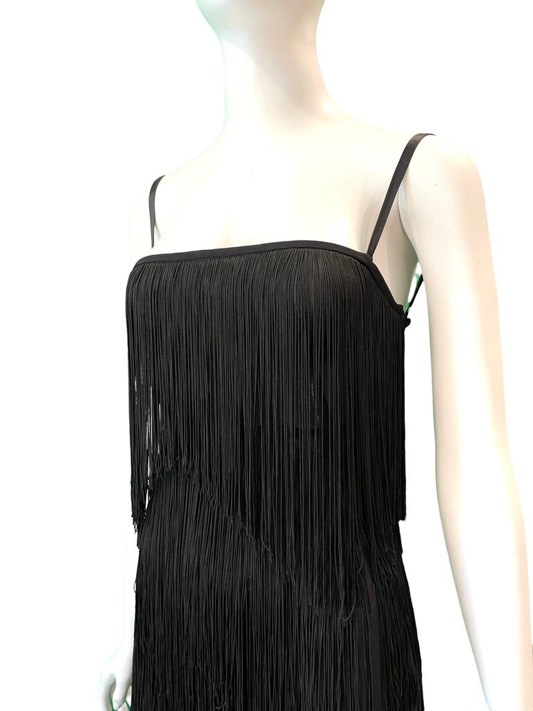 2003 Dolce & Gabbana black fringe dress with lace up corset in back

Lacing can be made tighter of looser to fit
CONDITION: Excellent 
Silk & Rayon fabric
Made in Italy 
30