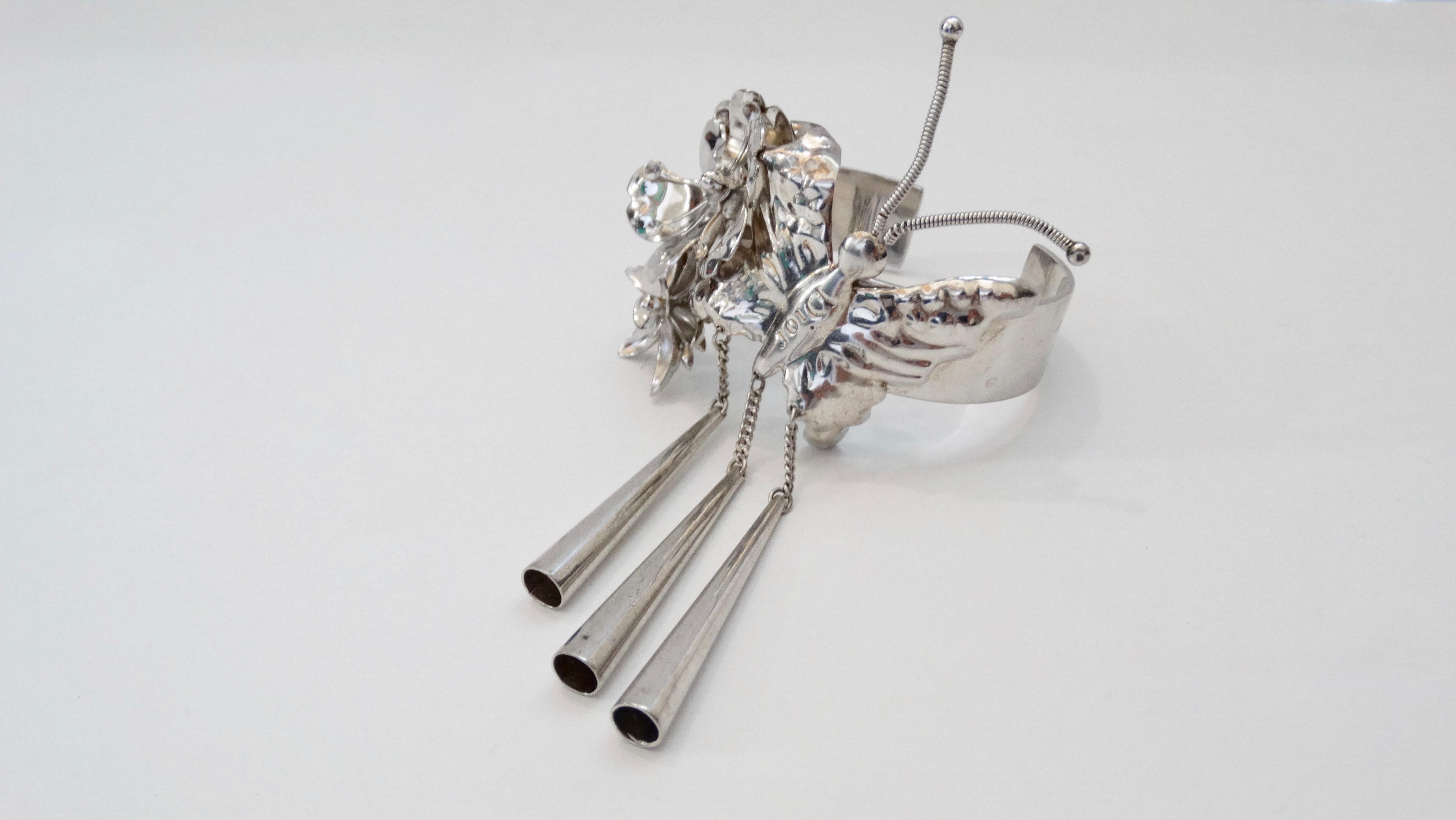 Show off some eye candy with this true work of art by John Galliano for Dior! Circa 2003/2004 from their Fall/Winter collection, this cuff highlights influences from the Chinese and Japanese culture. Crafted from Silver and adorned with a gorgeous
