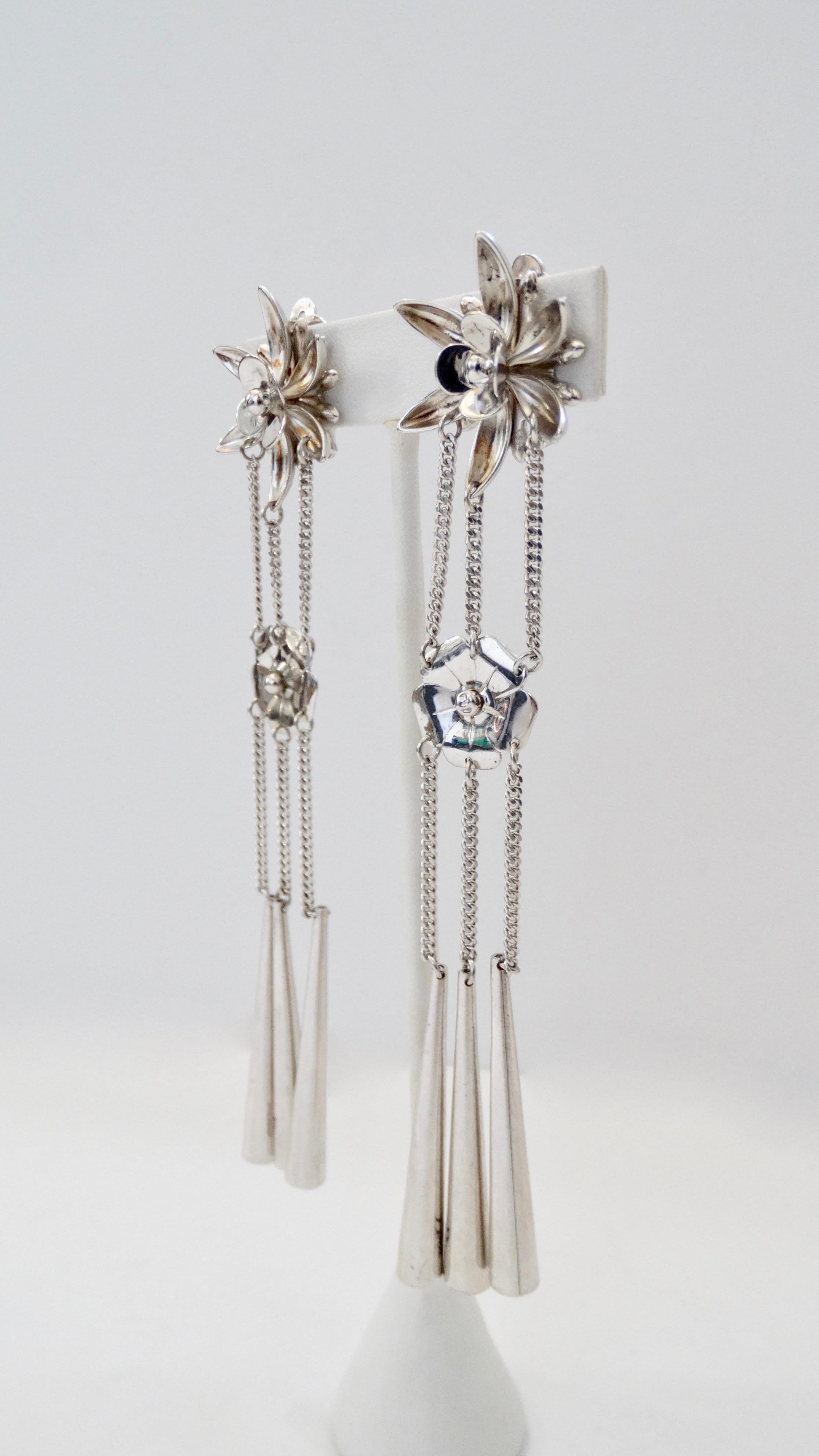 Show off some eye candy with these works of art by John Galliano for Dior! Circa 2003/2004 from their Fall/Winter collection, these earrings highlight influences from the Chinese and Japanese culture. Crafted from Silver and adorned with a gorgeous