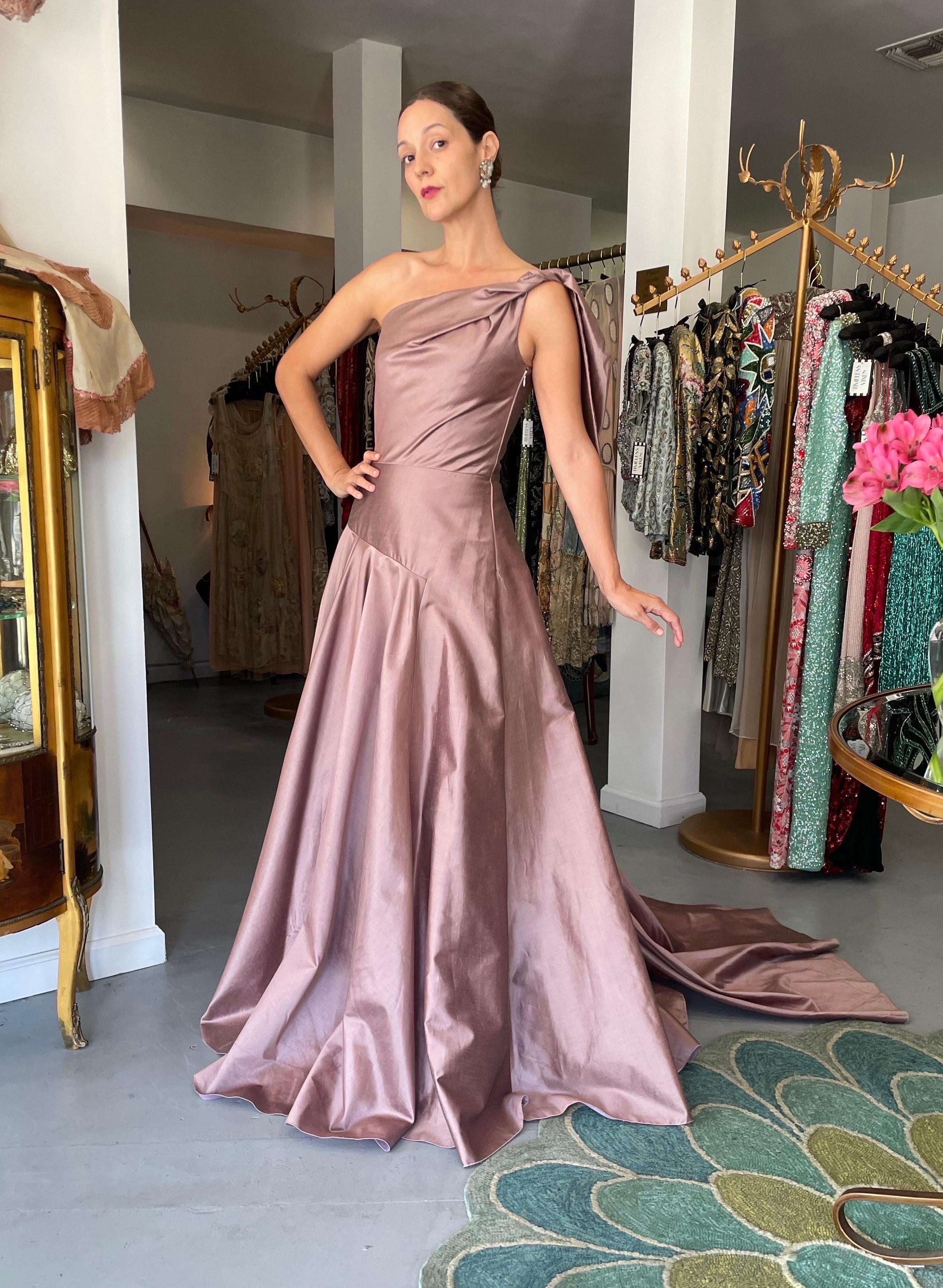 A totally breathtaking and truly timeless Givenchy mauve pink silk asymmetric one-shoulder full skirted trained gown dating back to Julien McDonald's 2003 fall/winter collection.  Givenchy, the name itself evokes glamour, refined elegance,