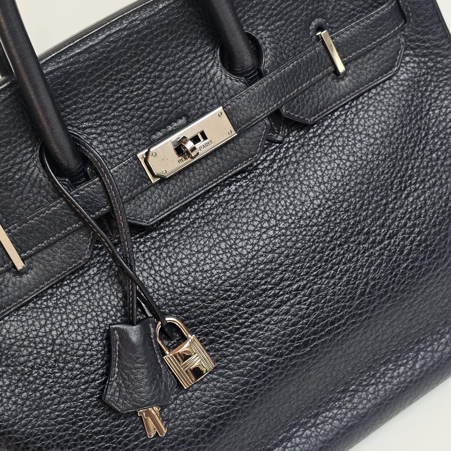 Classic Birkin 35 in black large togo leather with palladium hardware. Slight tarnishing on the hardware due to storage. Slight rubbing on the corners of the bag as well. Overall still in well kept condition. Comes with its tools, dust bag and