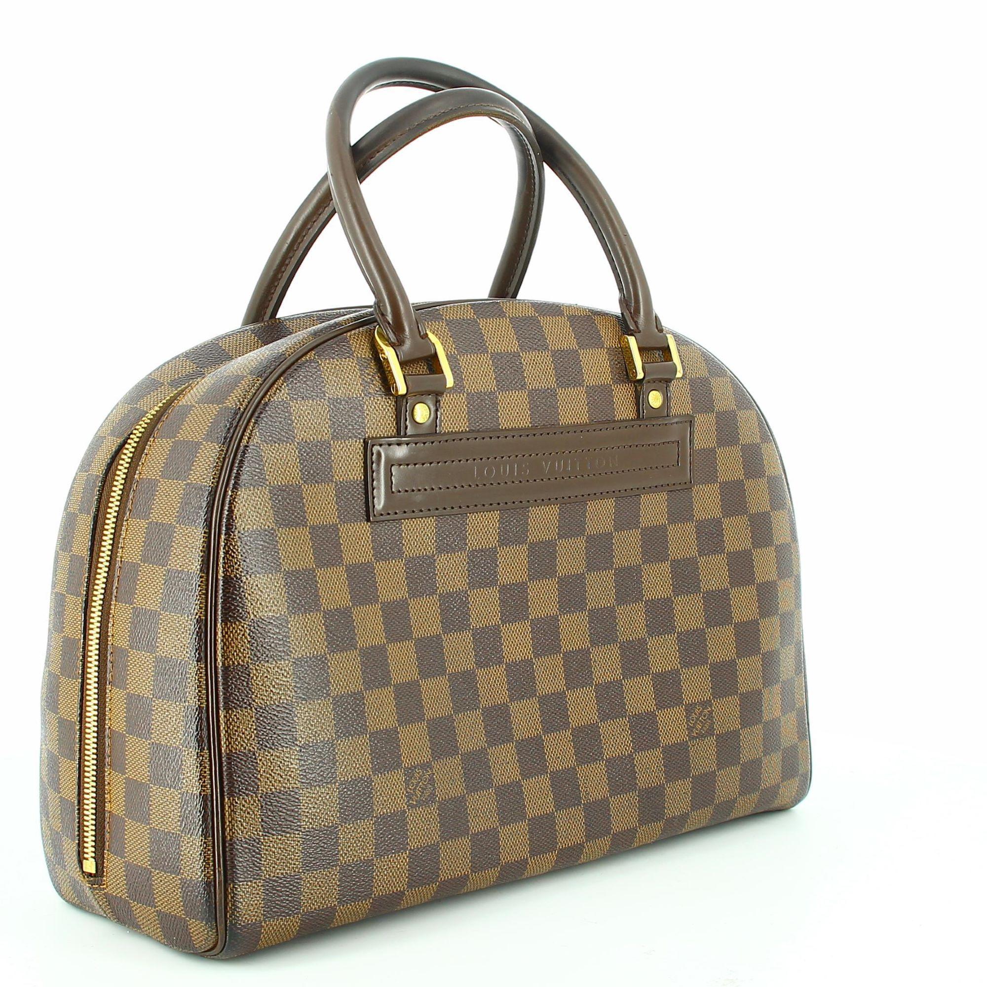 2003 Louis Vuitton Damier Nolita Bag.
Very good condition show some signs of use and wear but nothing visible. Double closure leading to an interior with three compartments, one of which has a zip. The perfect companion for your favourite