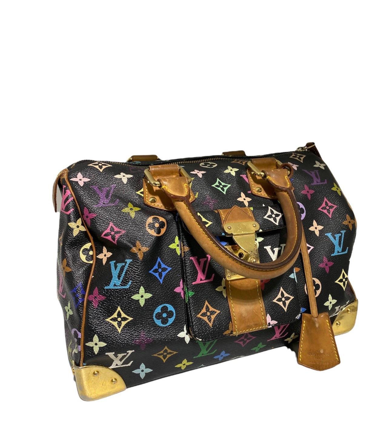 Louis Vuitton bag, Speedy 30 model, Takashi Murakami limited edition, made of multicolor leather with black background and golden cowhide inserts and hardware. Equipped with a zip closure, internally lined in beige suede, very roomy. Equipped with