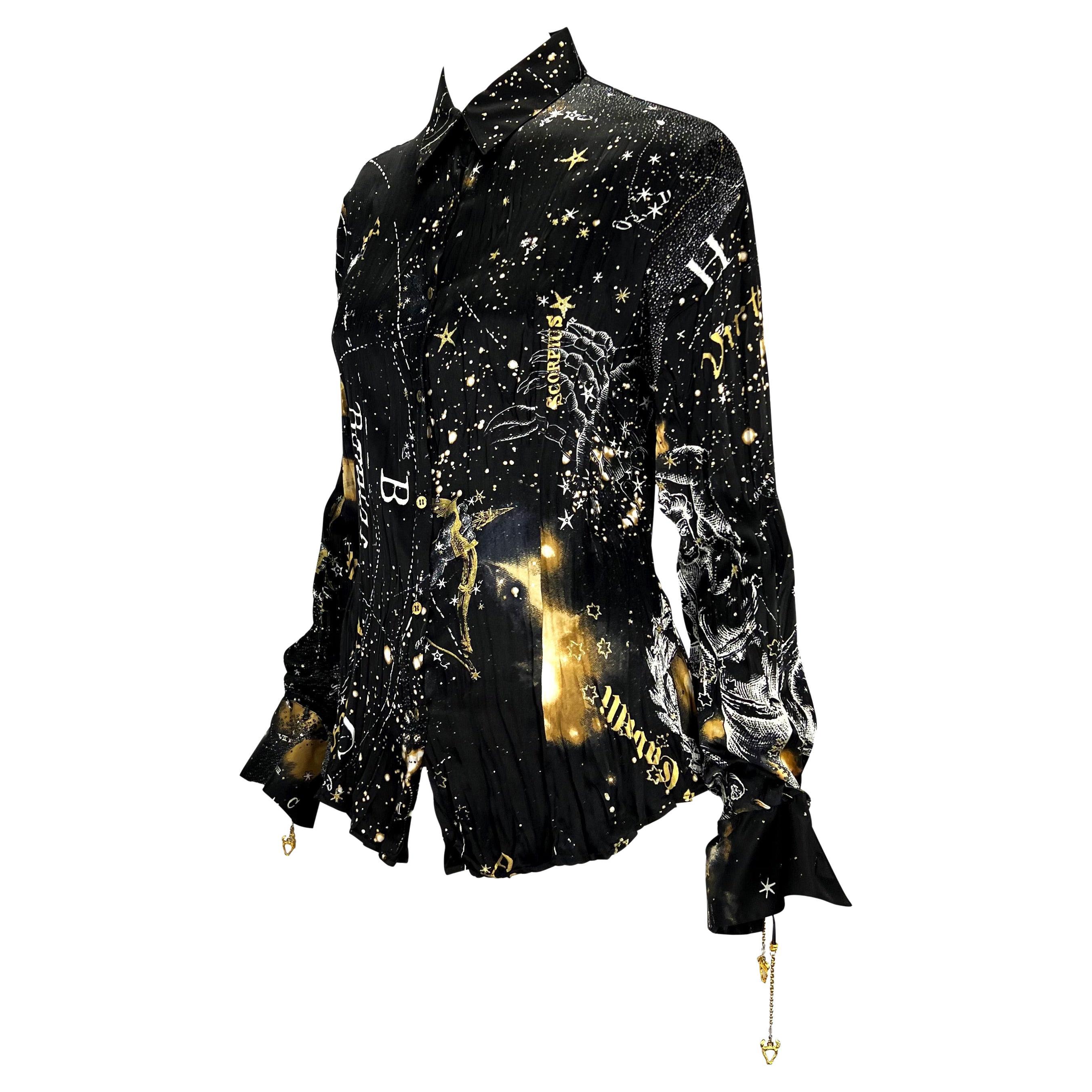 TheRealList presents: a stunning astrology print long sleeve button-down blouse, designed by Roberto Cavalli. From 2003, this sought-after print features constellations and depicts some of the horoscope signs. The blouse features a collar,