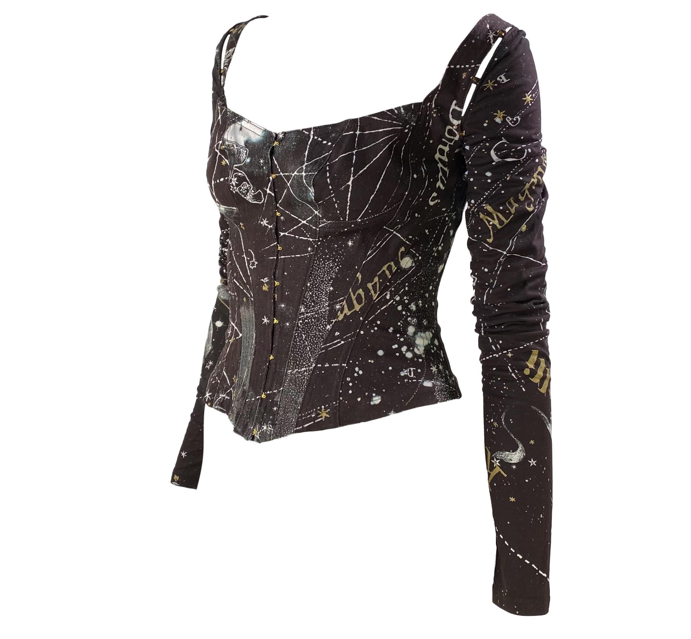Presenting a stunning astrology print corseted top, designed by Roberto Cavalli. From 2003, this sought after print features constellations and depicts some of the horoscope signs. The versatile top can be worn with the attached long sleeves or they