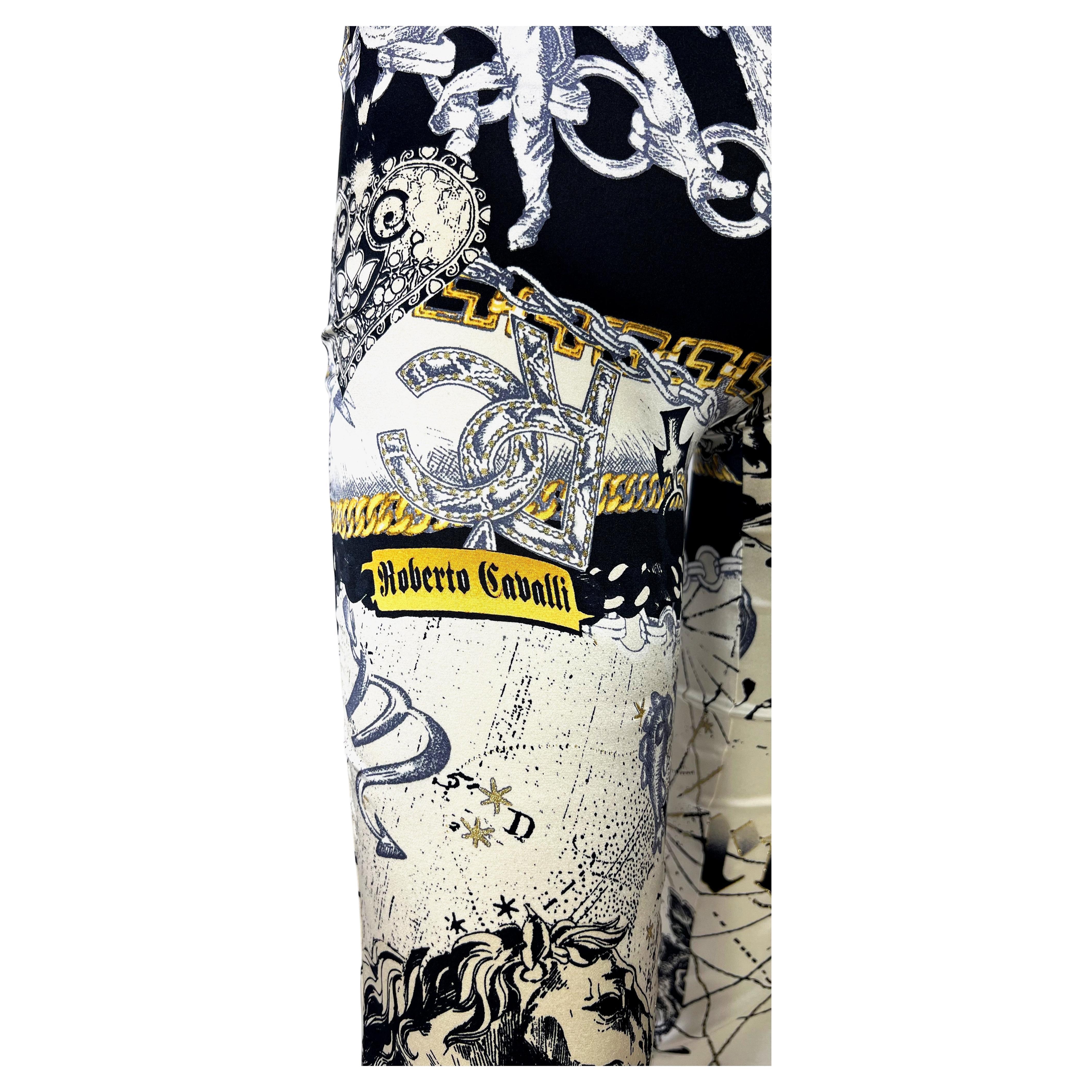 Presenting a pair of stunning astrology print silk Roberto Cavalli boot cut pants, designed by Roberto Cavalli. From 2003, this sought-after print features constellations and depicts some of the horoscope signs. A stunning piece of vintage Roberto
