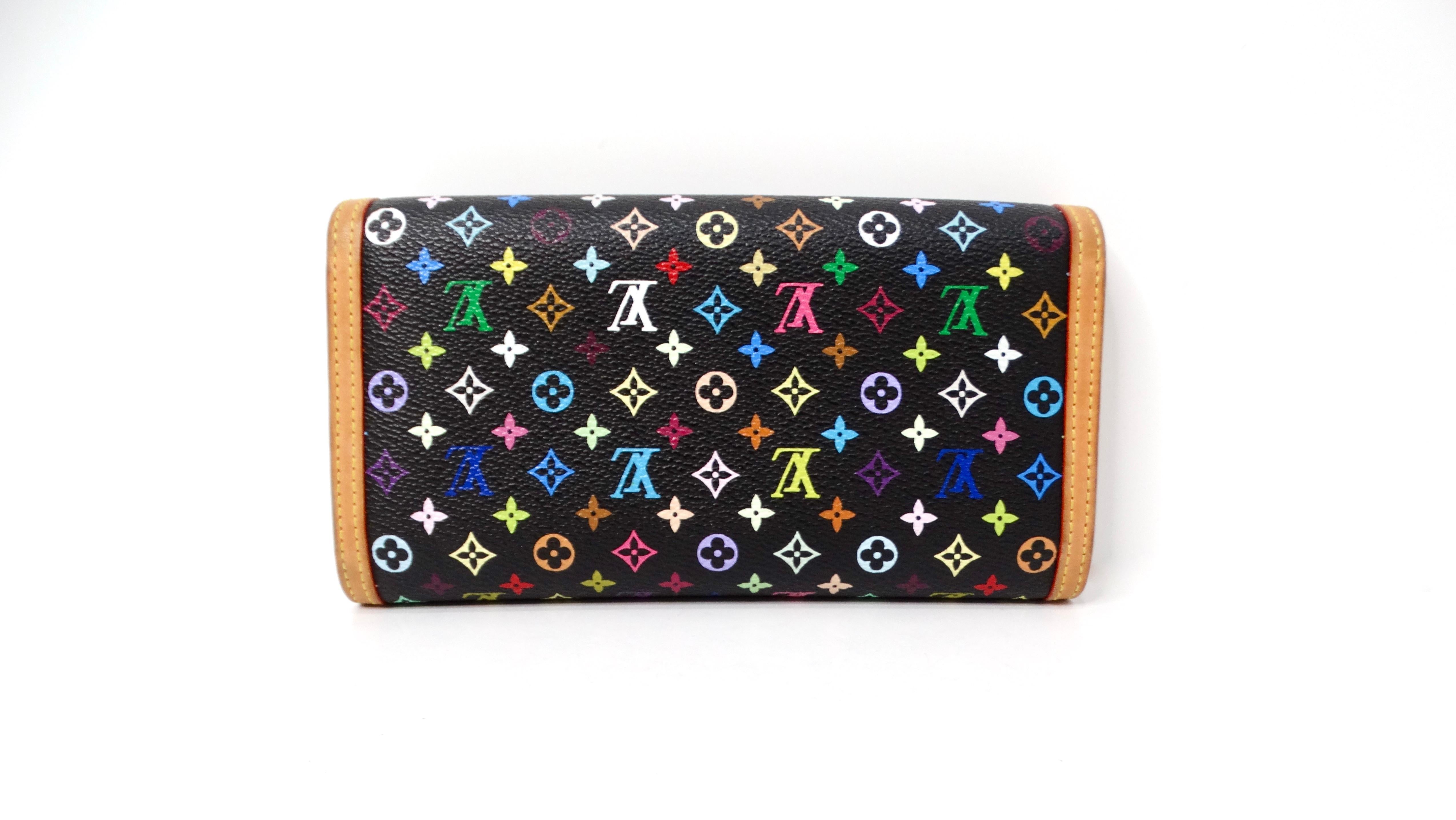 The 2003 Takashi Murakami x Louis Vuitton Porte Tresor Black Multicolor Wallet represents a stunning fusion of art and luxury fashion, embodying the visionary collaboration between the iconic Japanese artist and the prestigious French fashion house.