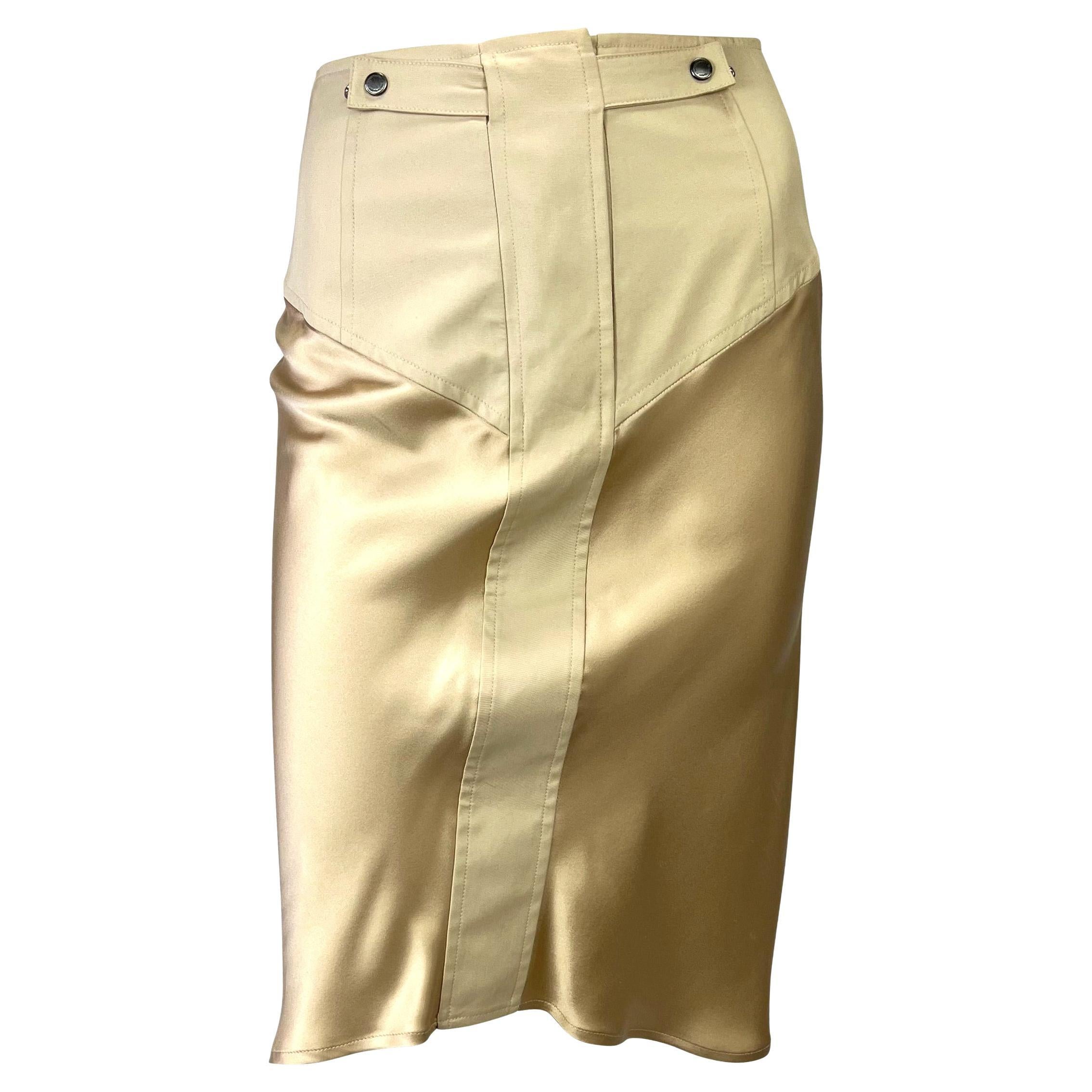 Presenting a champagne-colored silk satin Yves Saint Laurent Rive Gauche skirt set, designed by Tom Ford. From 2003, this beautiful set is made up of a silk satin and canvas jacket and matching skirt. The jacket features a stand-up collar, two