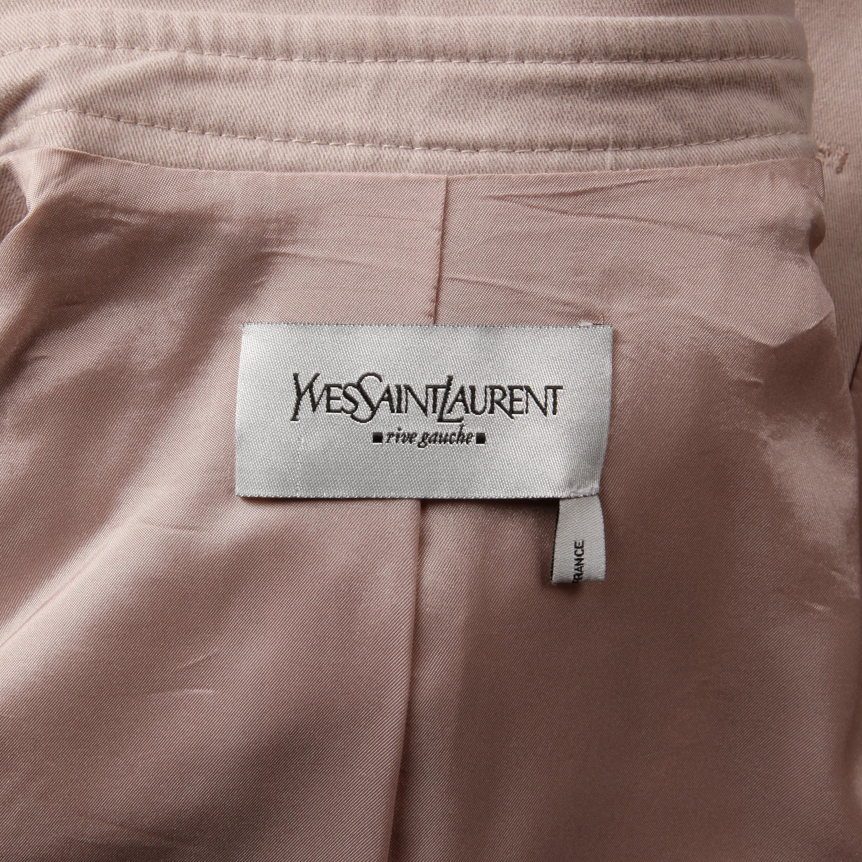 Iconic and collectible 2003 Tom Ford for Yves Saint Laurent Rive Gauche pink jacket and skirt ensemble with asymmetric ruffle. The skirt is fully lined with front button, buckle and two-way zipper closure (you may unzip from the bottom up to create