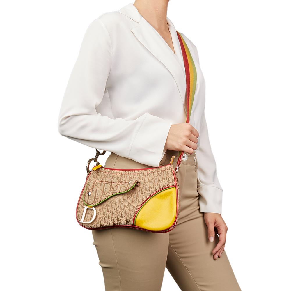 CHRISTIAN DIOR
Brown Monogram Canvas & Yellow Calfskin Leather Rasta Crossbody Double Saddle Bag

Xupes Reference: HB2101
Serial Number: 08RU 1024
Age (Circa): 2004
Authenticity Details: Date Stamp (Made in Italy) 
Gender: Ladies
Type: Shoulder,