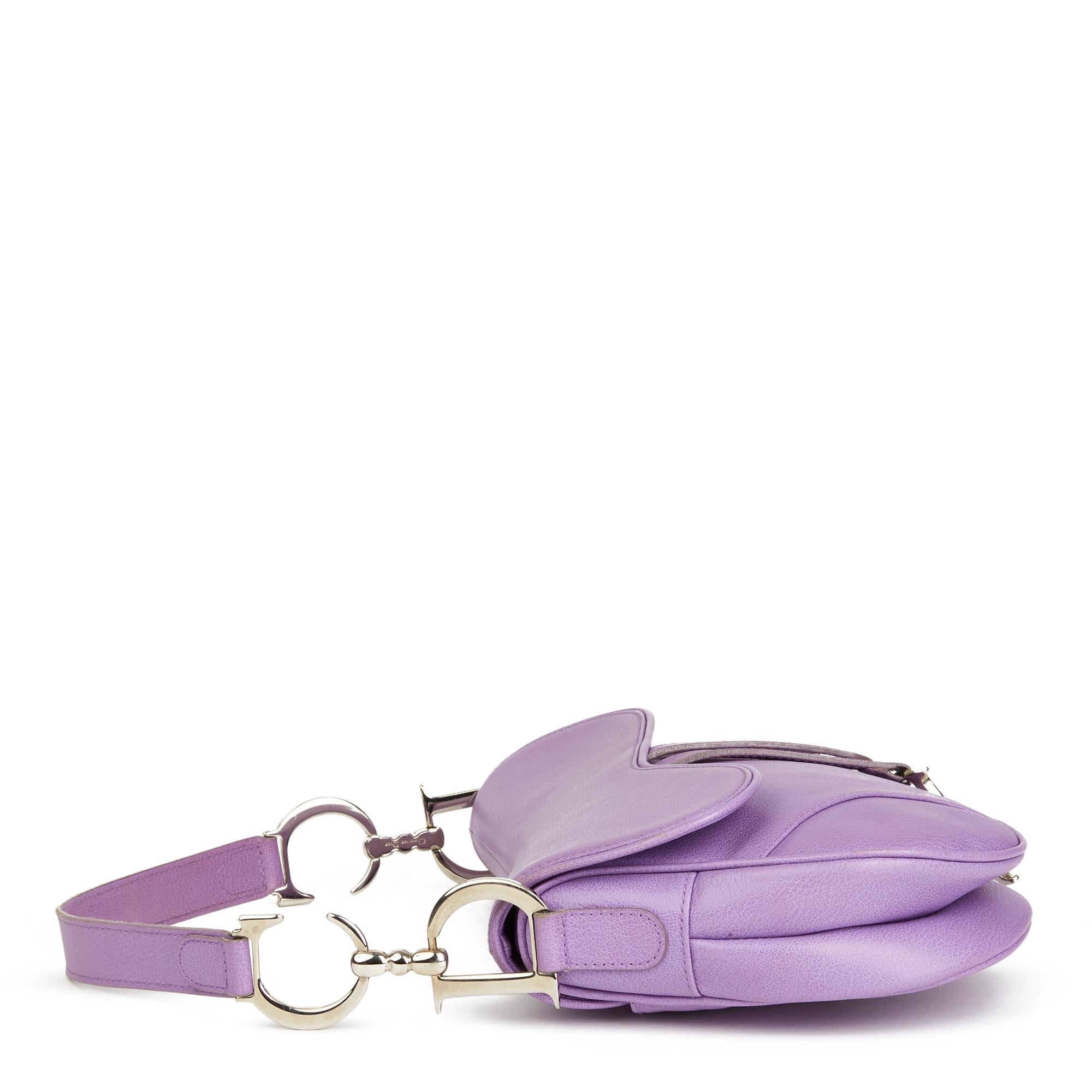 CHRISTIAN DIOR
Lilac Calfskin Leather Saddle Bag

Reference: HB2491
Serial Number: 06 RU 0064
Age (Circa): 2004
Accompanied By: Dior Dust Bag, Authenticity Card, Care Booklet
Authenticity Details: Date Stamp, Authenticity Card (Made in
