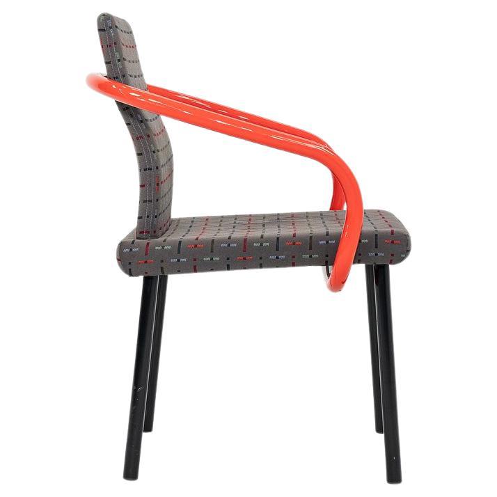 These are Mandarin Chairs, originally designed by Ettore Sottsass in 1986. These particular examples were produced by Knoll in the USA C. 2004. The chairs are comprised of sculptural orange/red enameled-steel arms, and have an upholstered seat &