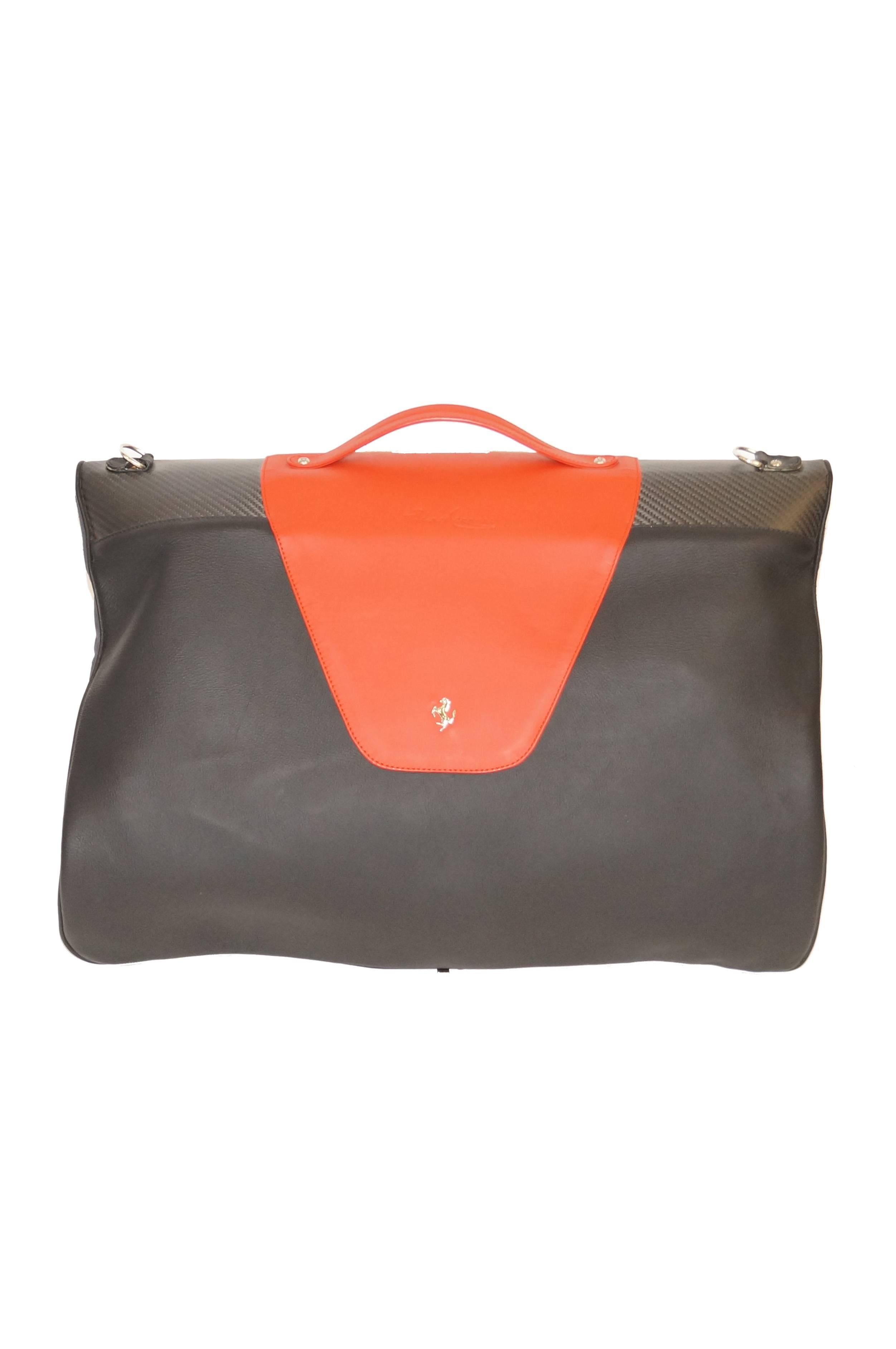 Exciting trio of luggage made especially for the Ferrari Enzo by Schedoni. The set includes two identical suit bags with folding hanger and dust covers, as well as a two - compartment hand bag with flap and zipper closure. The pieces are composed of