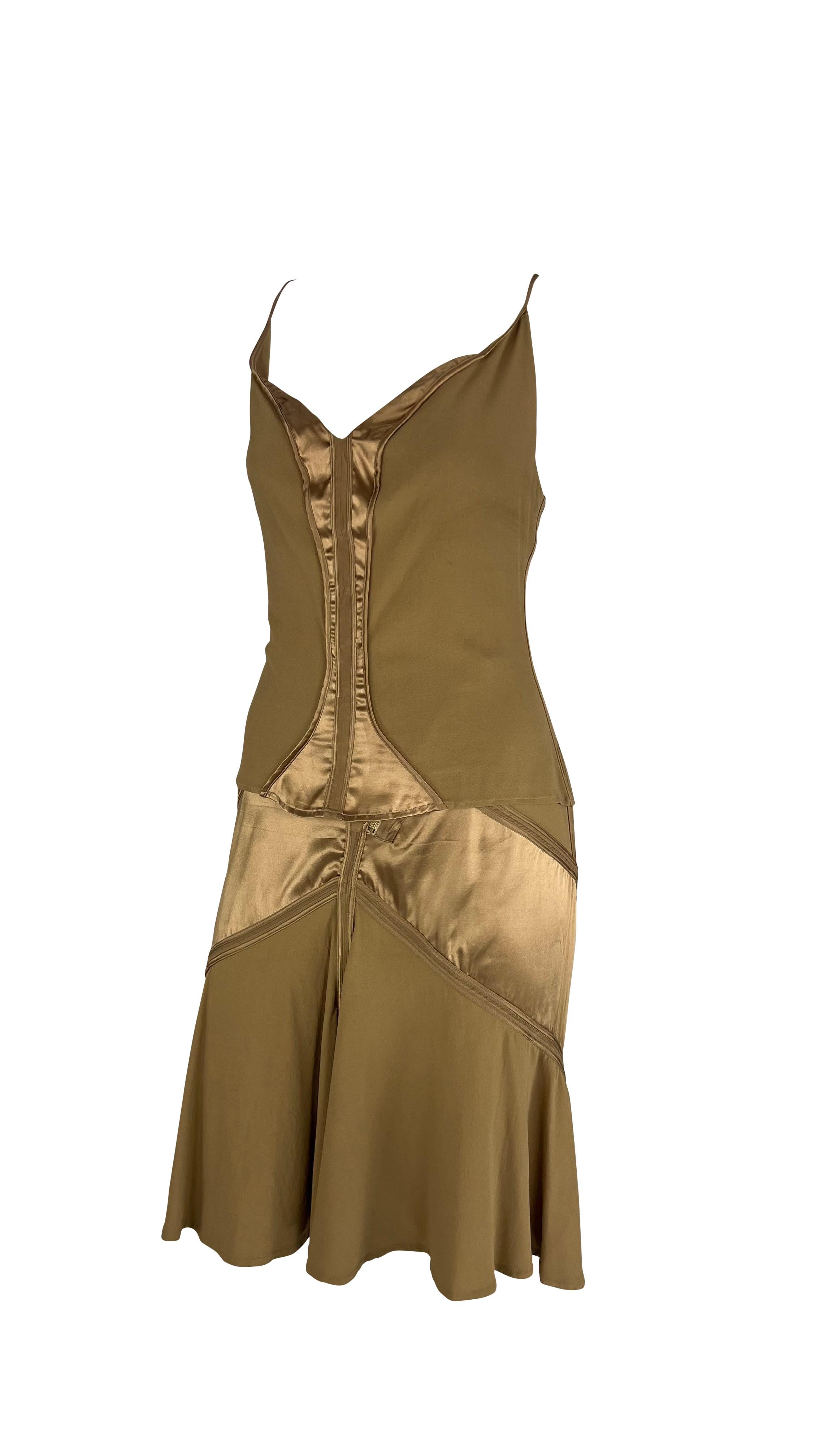 Presenting a beautiful copper-tone Roberto Cavalli tank top skirt set. From 2004, this set is comprised of a spaghetti strap tank top and a matching flare skirt. Both pieces feature silk satin details and a gold zipper accent. Whether worn together