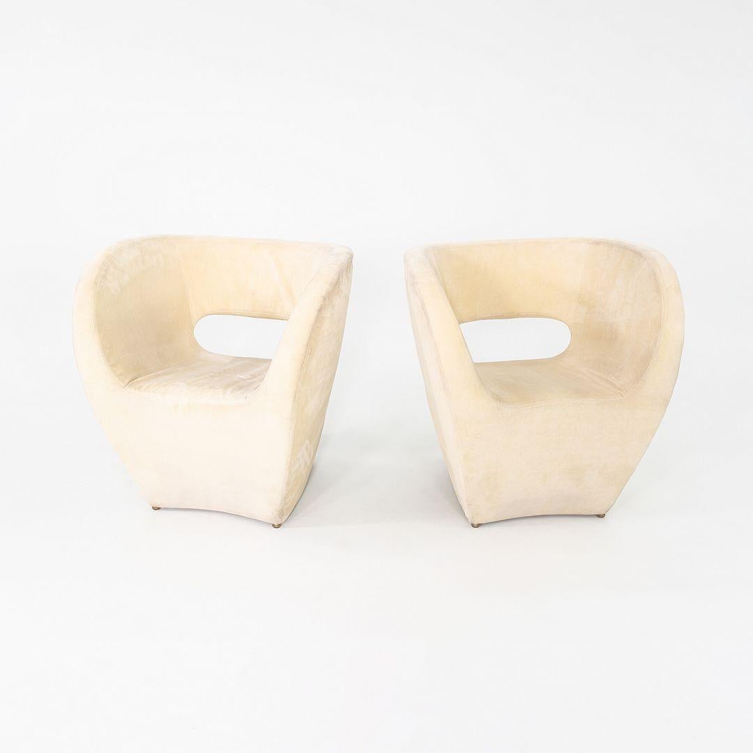 This is a Victoria and Albert Lounge Chair, originally designed by Ron Arad for Moroso in 2000. These particular examples date to 2004. The chairs are comprised of an injection-molded polyurethane foam shell with white upholstery.

The listed price