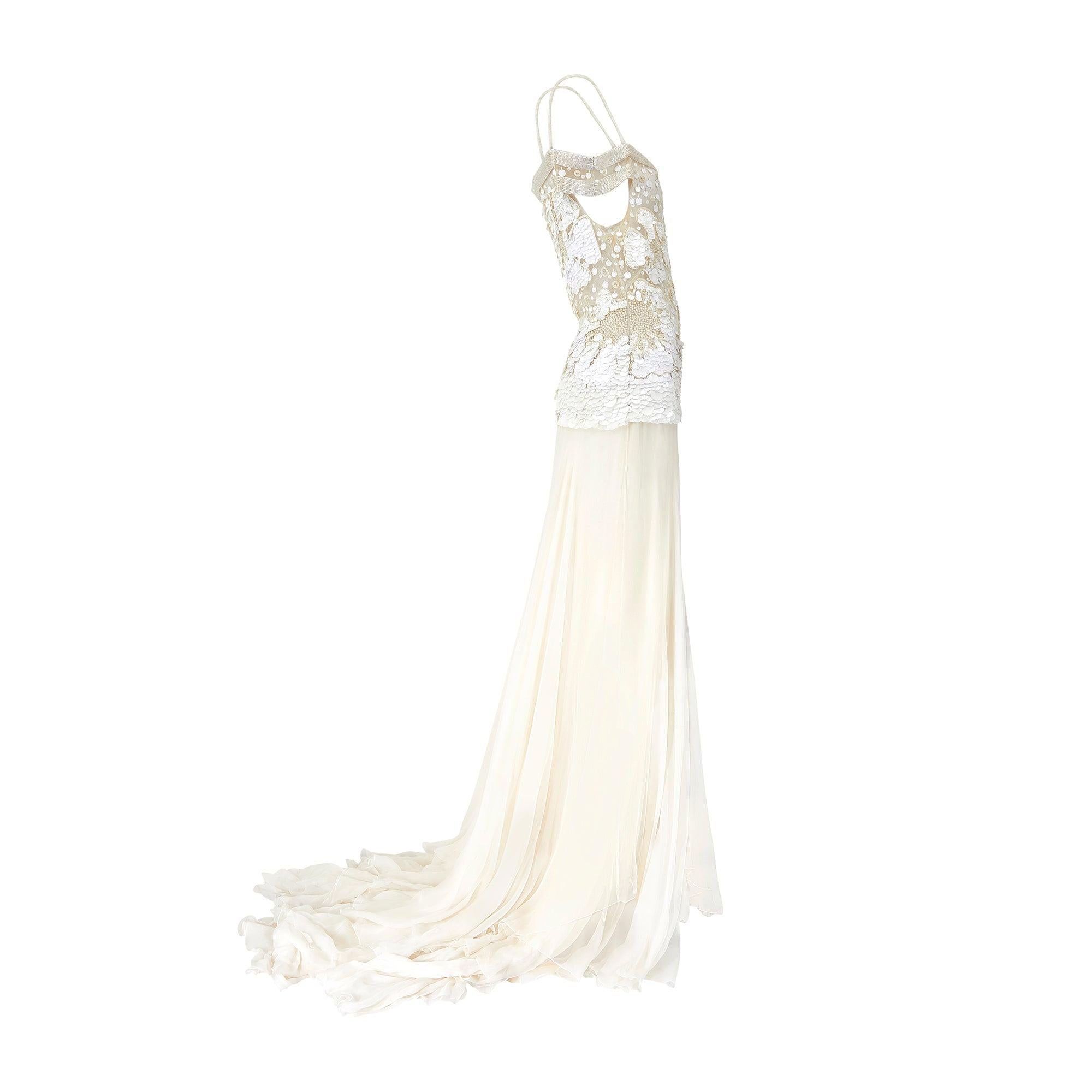 The twin of this showstopping Valentino dress walked the runway for the fashion house’s Spring 2004 collection and was Look 79 of 80 making it a finale presentation piece. The collection drew on the most romantic elements of vintage lingerie,