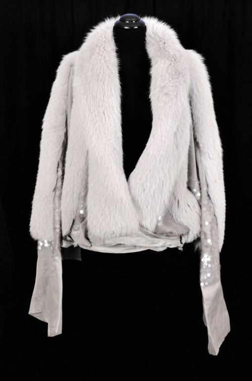 GUCCI FOX FUR AND SILK ORGANZA JACKET 

A FABULOUS CREATION FROM TOM FORD'S LAST COLLECTION FOR GUCCI

A truly phenomenal jacket! Made of thick and soft fox fur and paillettes embroidered organza. Long ties at hem.

Size 40

100% fox fur, 100%