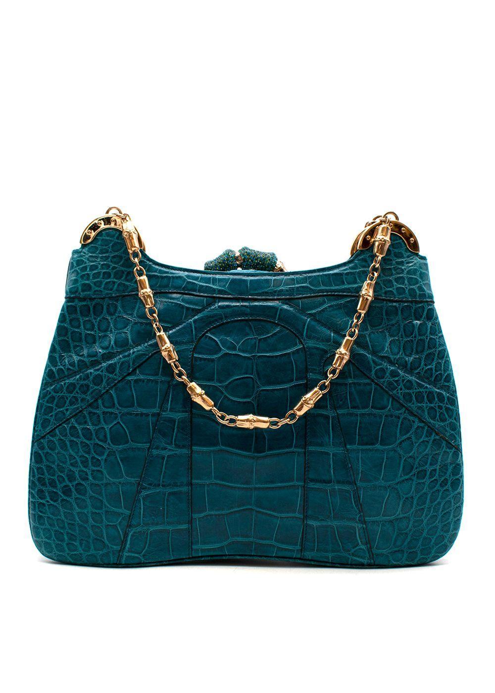 2004 Vintage Iconic Tom Ford for Gucci teal crocodile bag
Teal crocodile, with crystal and gold-tone metal accents
Green silk interior with one open top pocket and a logo branded patch
Materials: Crocodile, Silk
Made in Italy
Excellent condition

