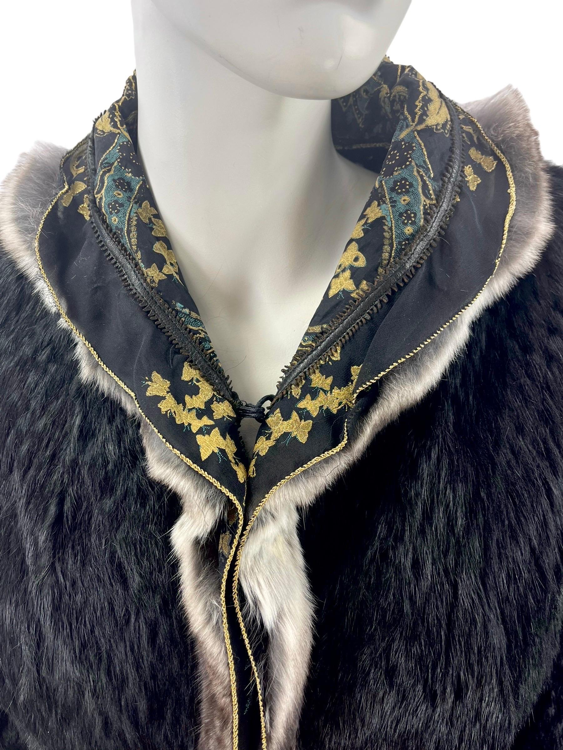 Vintage Roberto Cavalli Black Lapin Fur and Silk Corset Jacket

Amazing creation from 2004 Collection. 
Constructed from laser cut black lapin fur and gold brocade silk.
Corset lace-up fastening at the back
Finished with chinchilla trim.
Made in