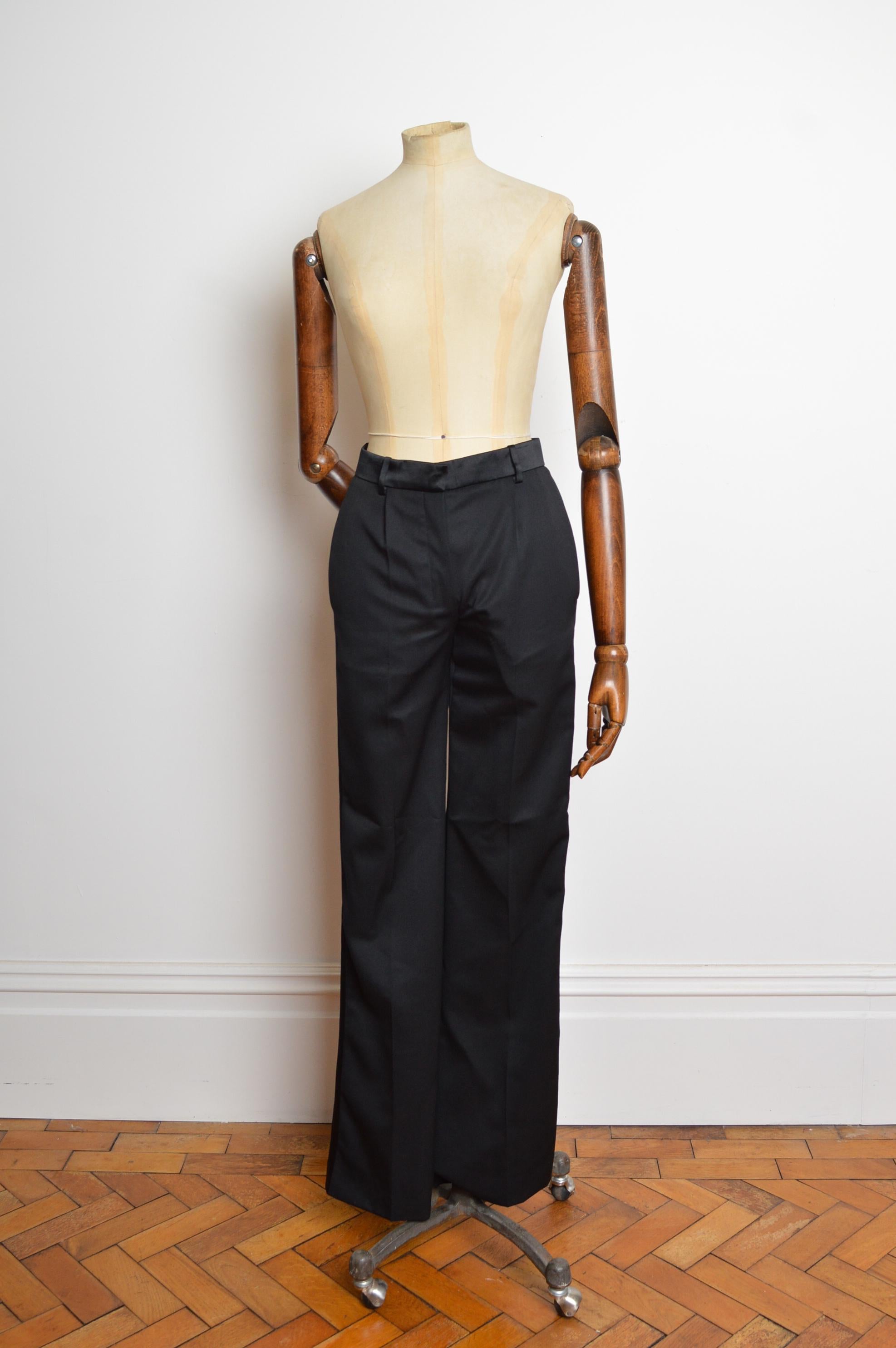 2004 Yves Saint Laurent by TOM FORD Tuxedo pants featuring a sexy understated satin strip down the leg, zip fasten closure and slim silhouette. 
Iconic, Understated Elegance.
Measurements are provided in inches (‘’)
Recommended Size; UK 6