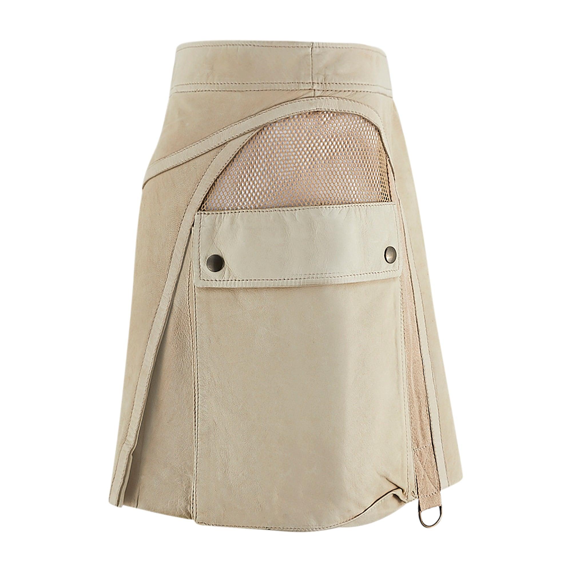 This unusual Alexander McQueen skirt is from the late designer's pre spring/summer 2005 collection. Designed before Lee's tragic death in 2010, this buttery soft, beige leather mini-skirt features the ingenious tailoring that the designer was known