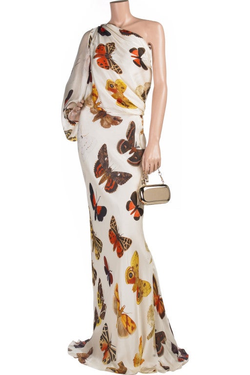 2005 Alexander McQueen One Shoulder Butterfly Print Gown 

This stunning evening gown which requires minimal accessories - a real investment piece.

Ivory long sleeve asymmetrical floor length evening gown. Alexander McQueen gown has a multi-colored